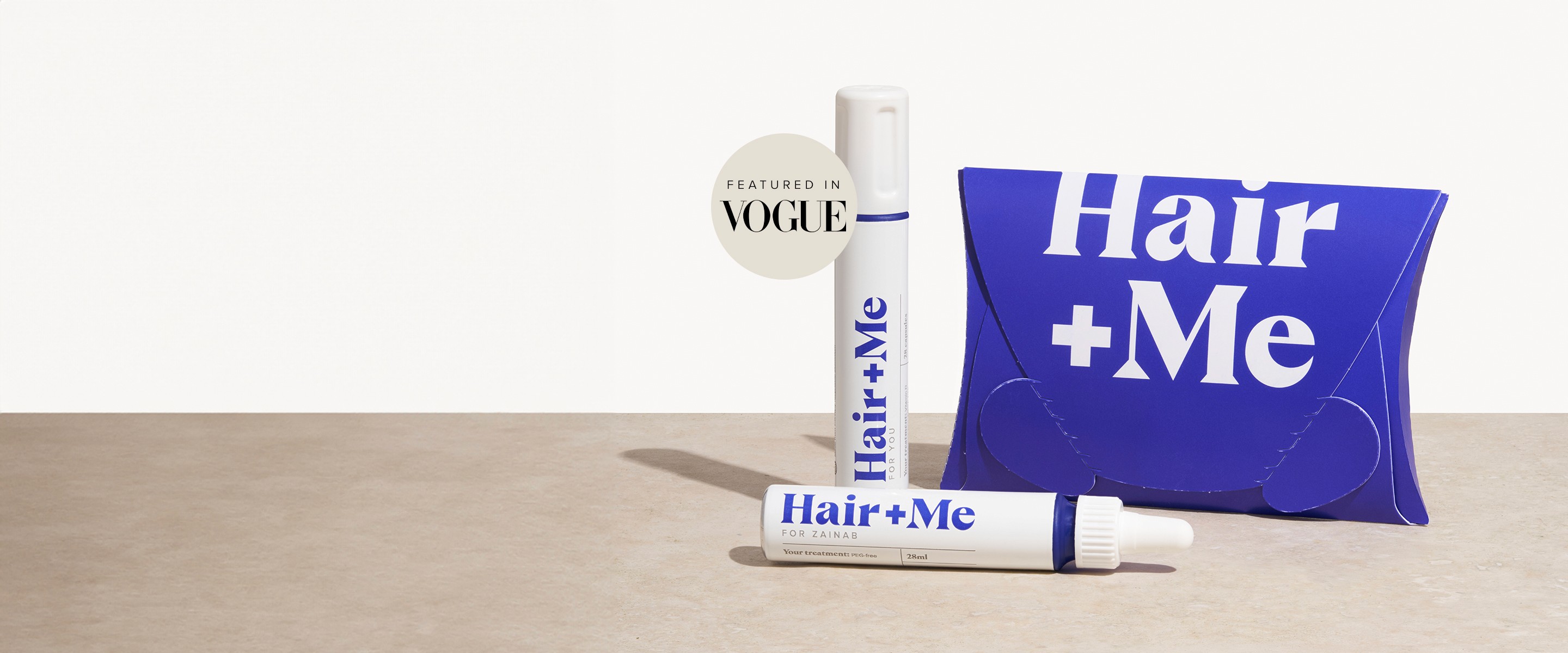 Image with products, The Capsules and The Drops dispayed with a pillow box. There is also a "featured in vogue" badge.