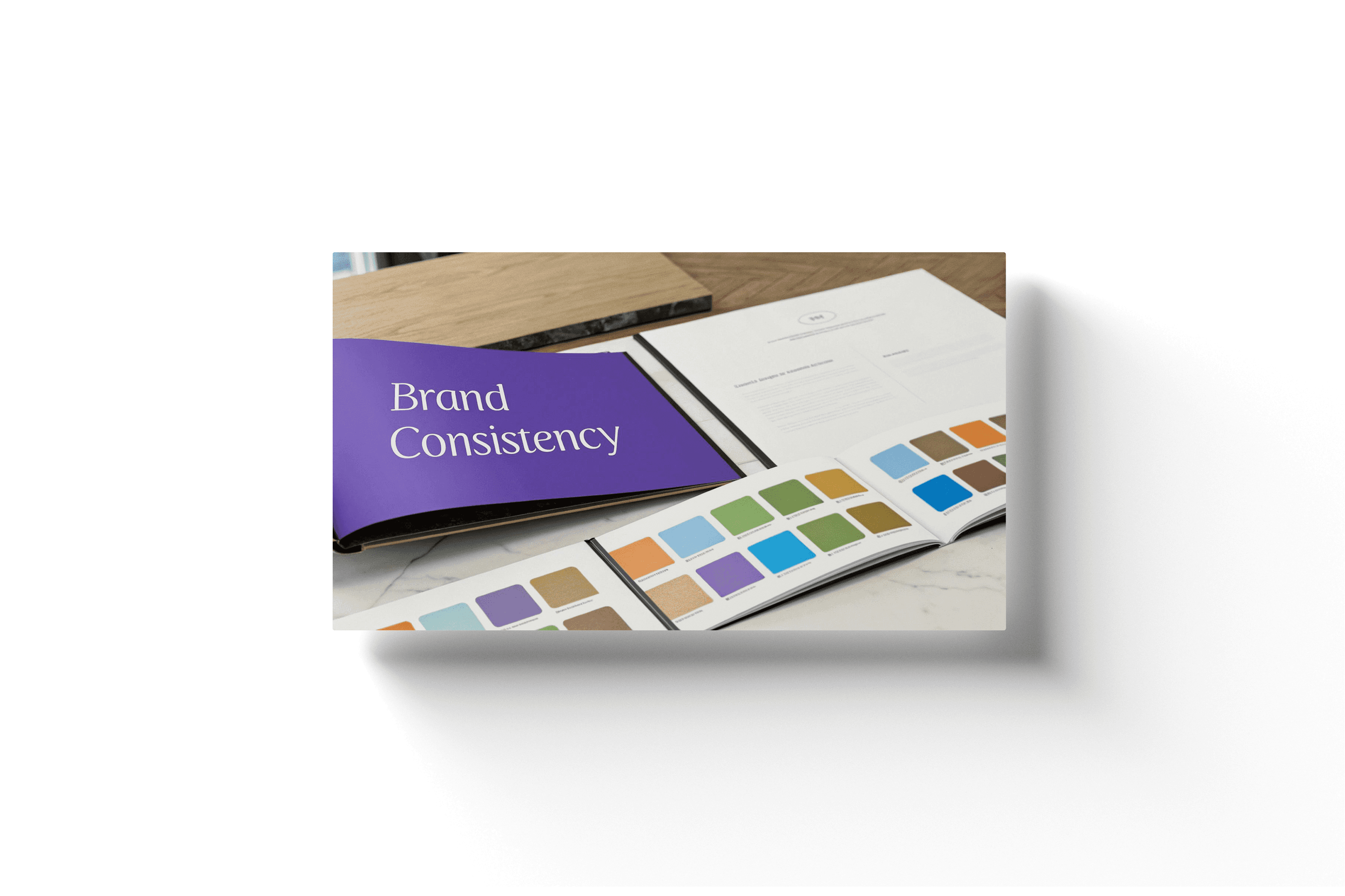 a paper with various colors and a purple card with the text 'brand consistency'