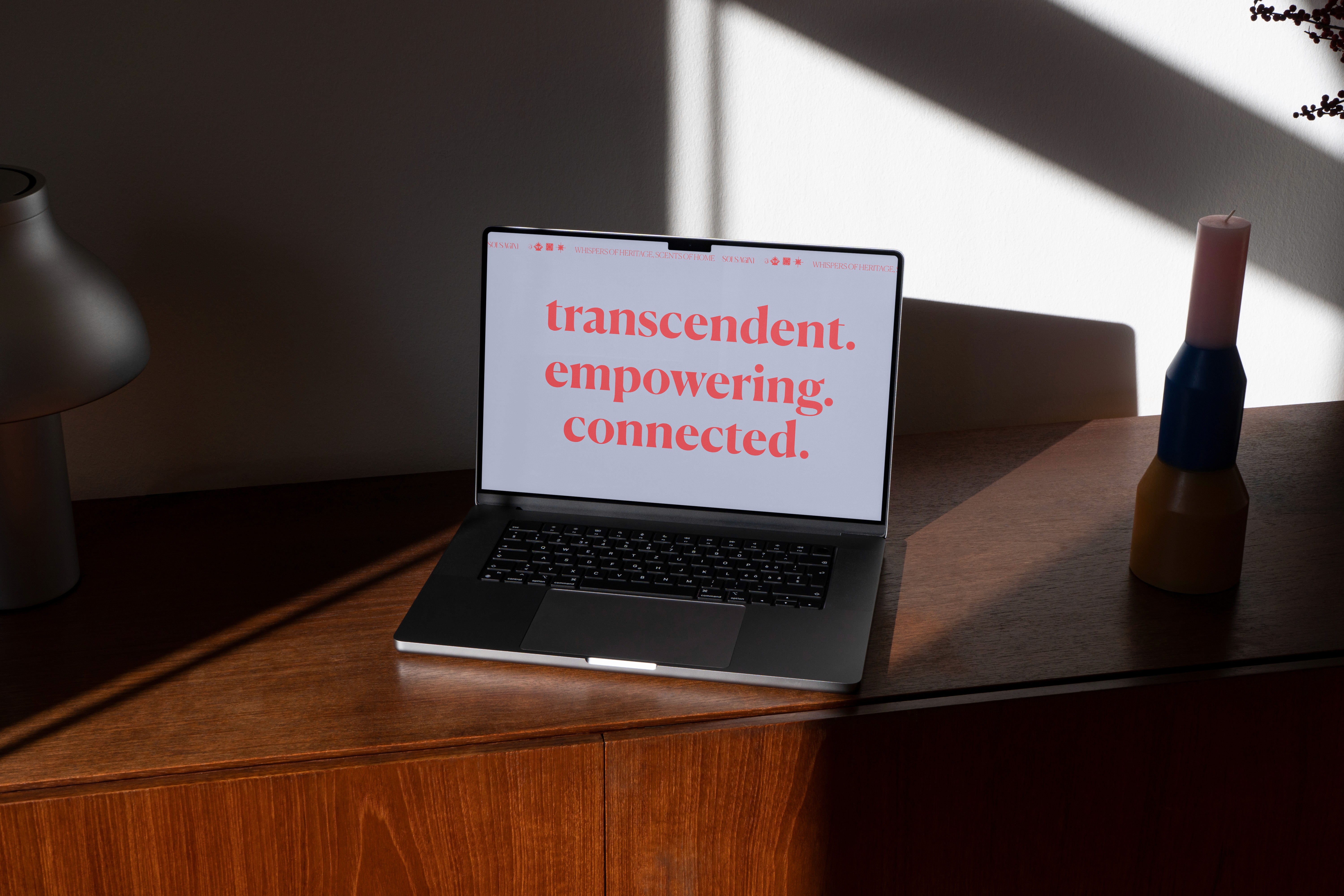 A mockup for a Macbook place on a table for an incense selection website