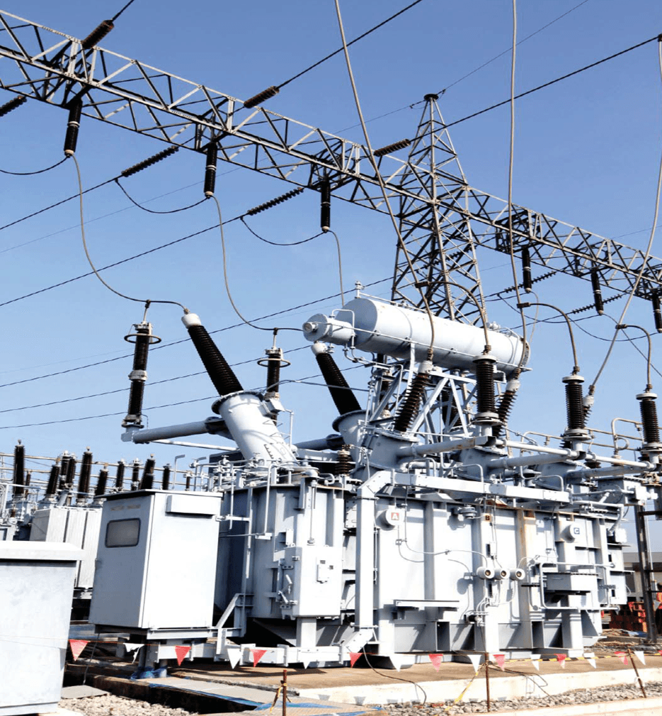 High-voltage power transformer housed in an outdoor substation with cooling fins