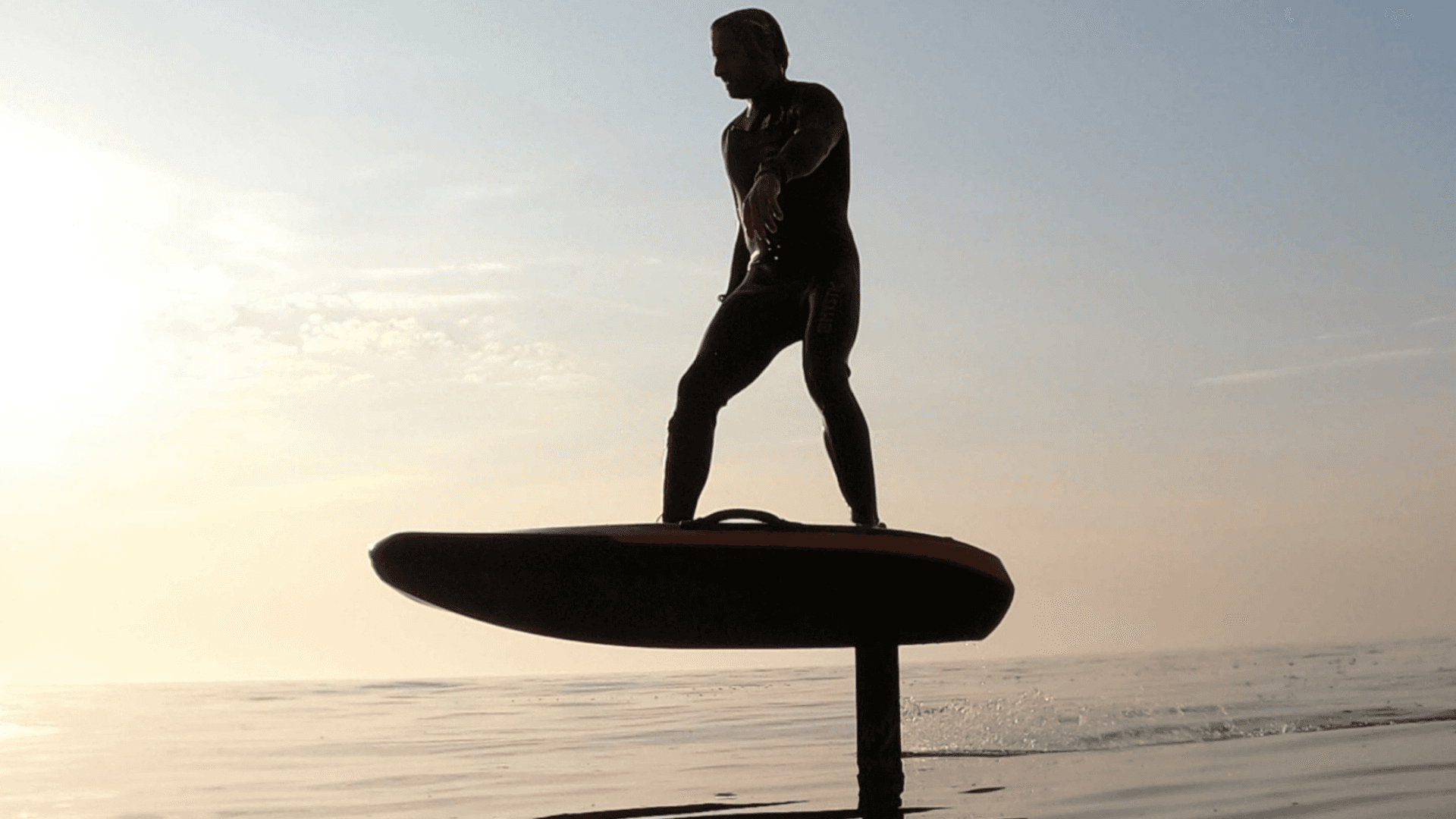 A man with surfboard at beach