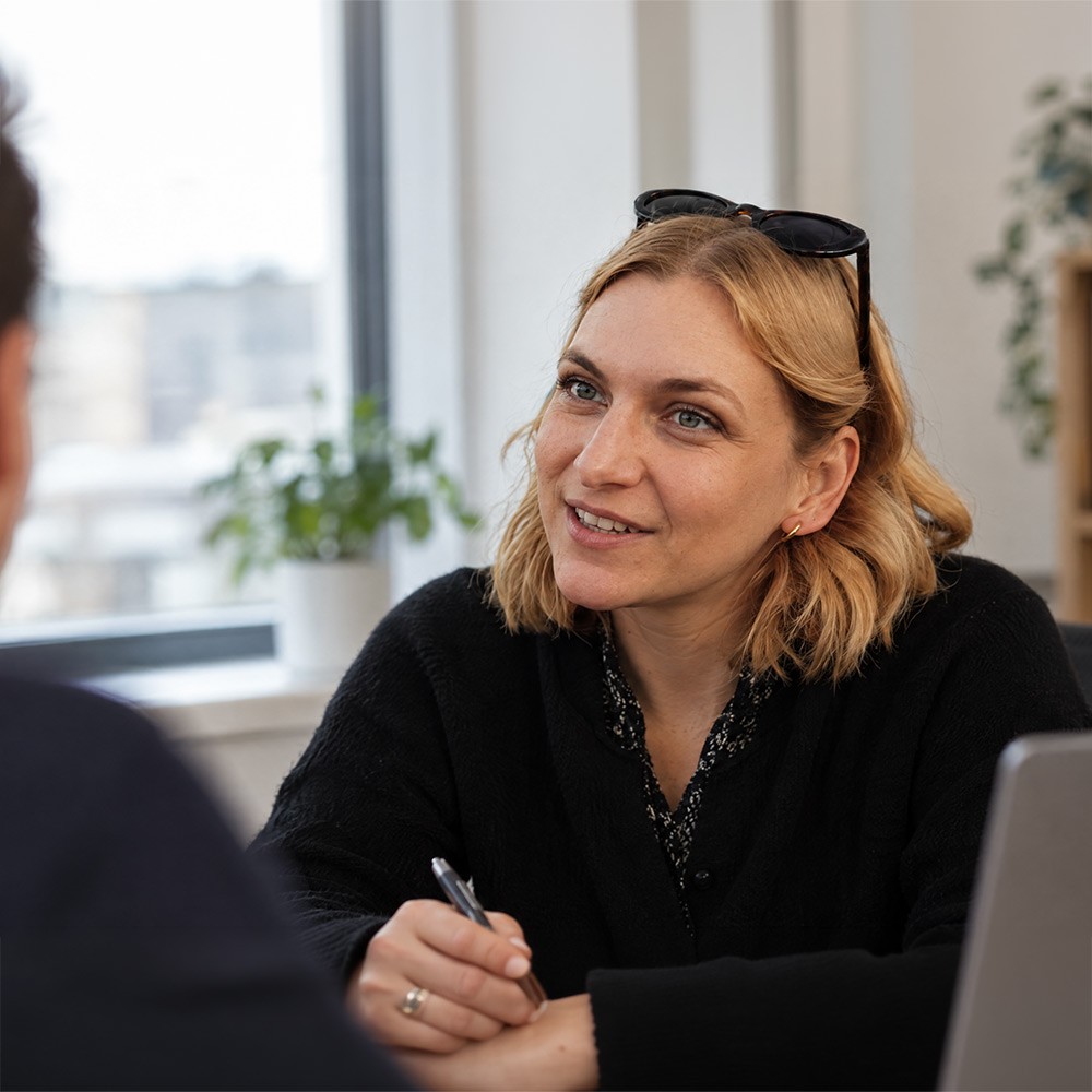 A Climbing Trees team member in a client meeting
