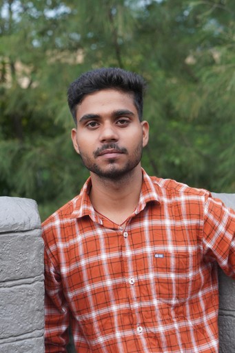 a man in an orange and white checkered shirt