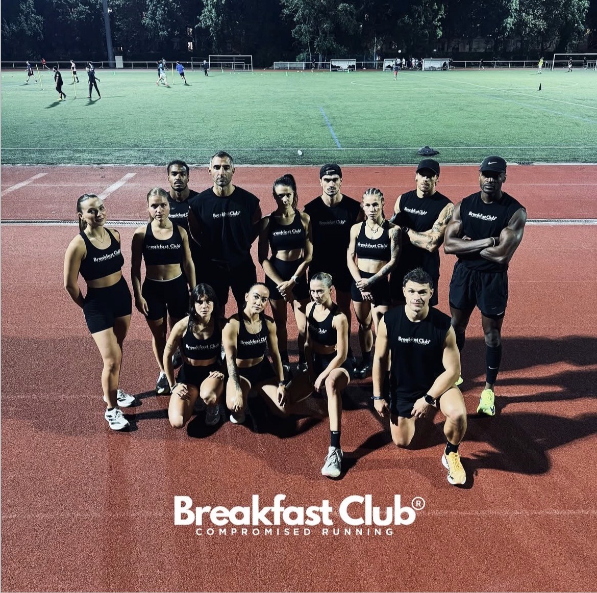 man in red suit posing in the night