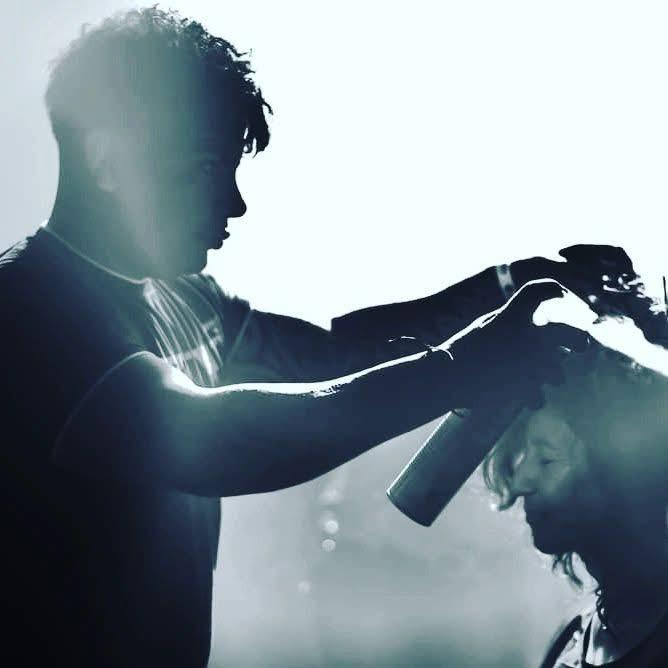 Beautiful girl standing near tree foliage