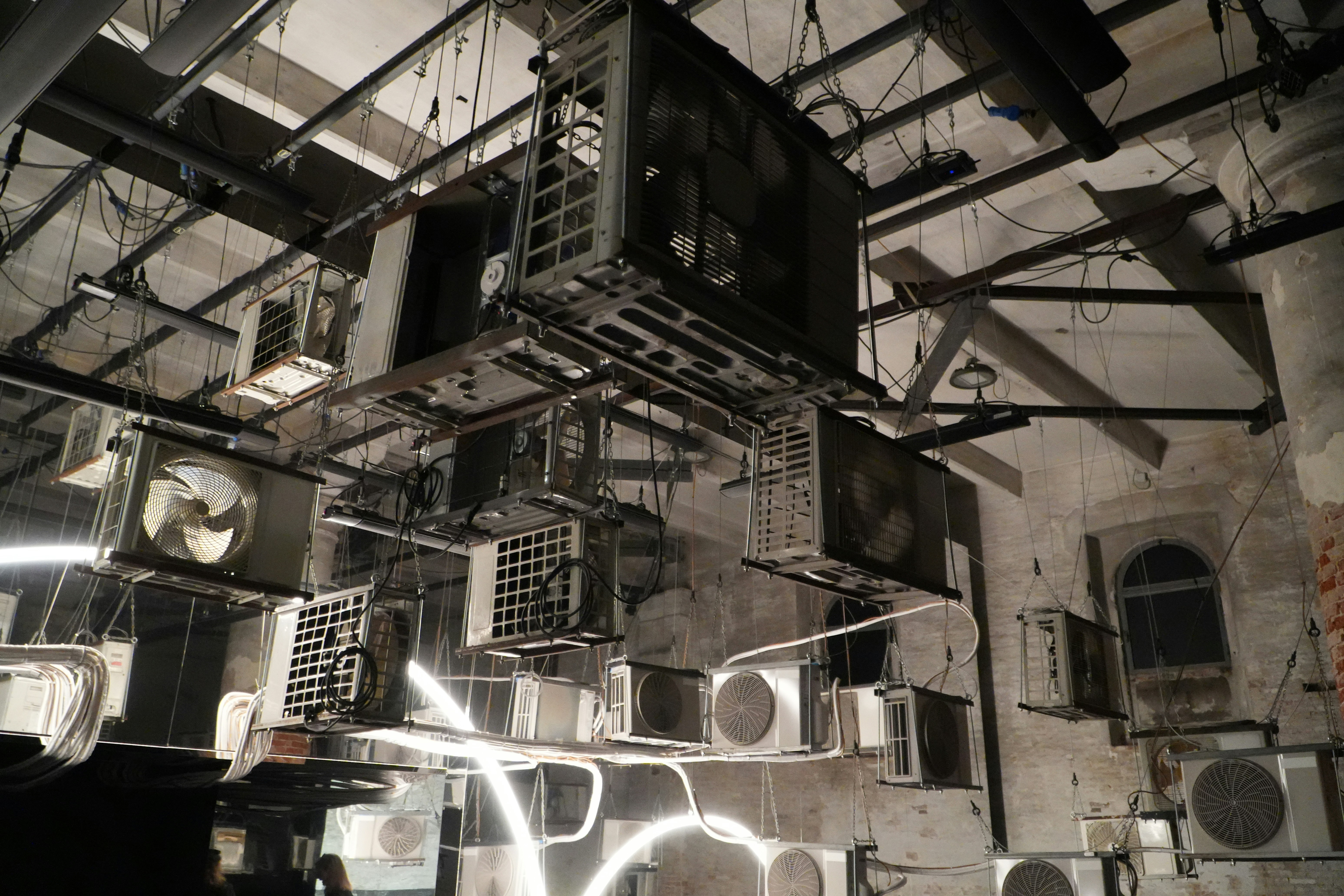 Multiple air conditioning units hanging indoors