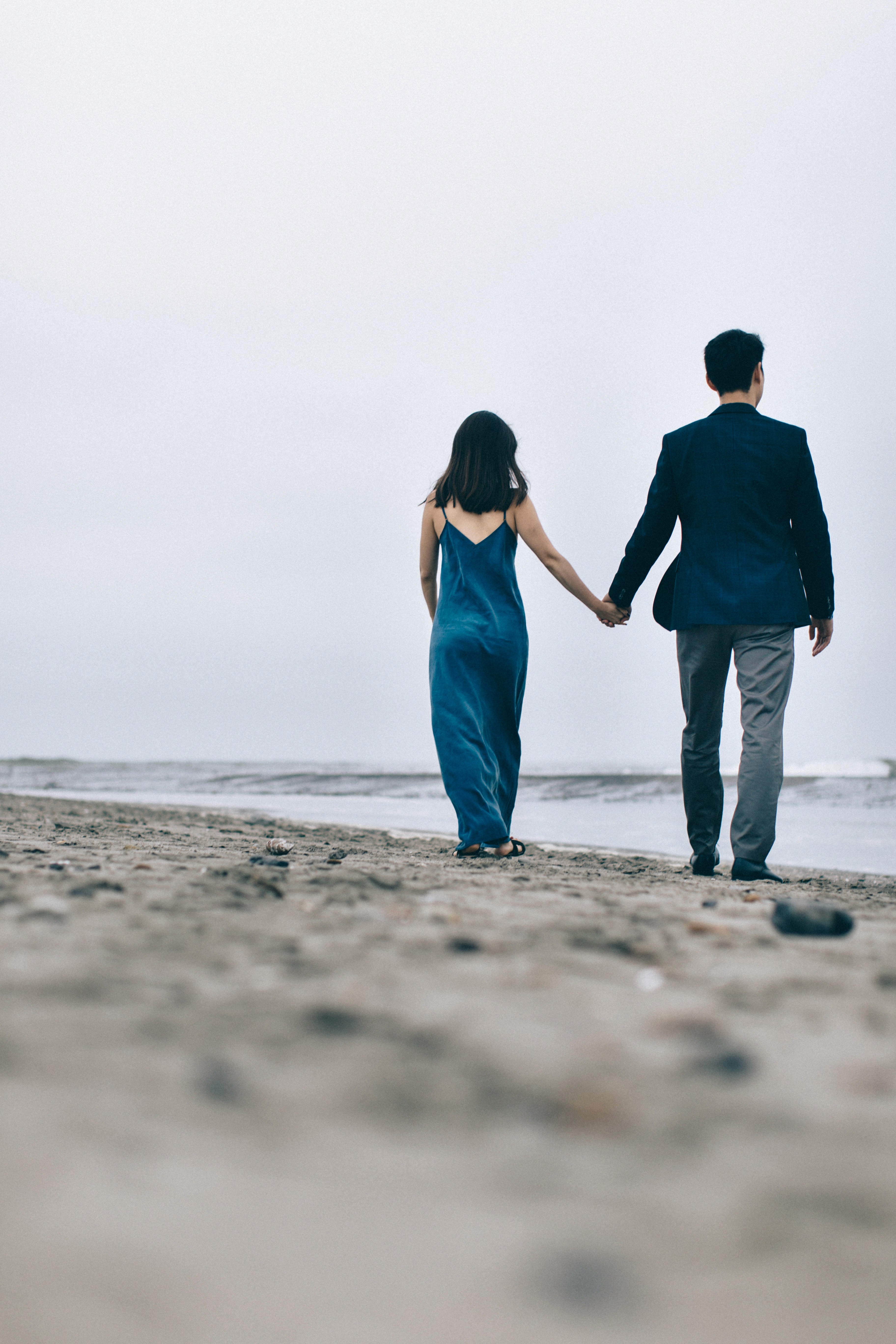 Couple holding hands in the distance