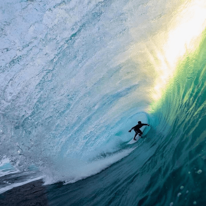 Surfer riding a wave – surfboard rental in oahu