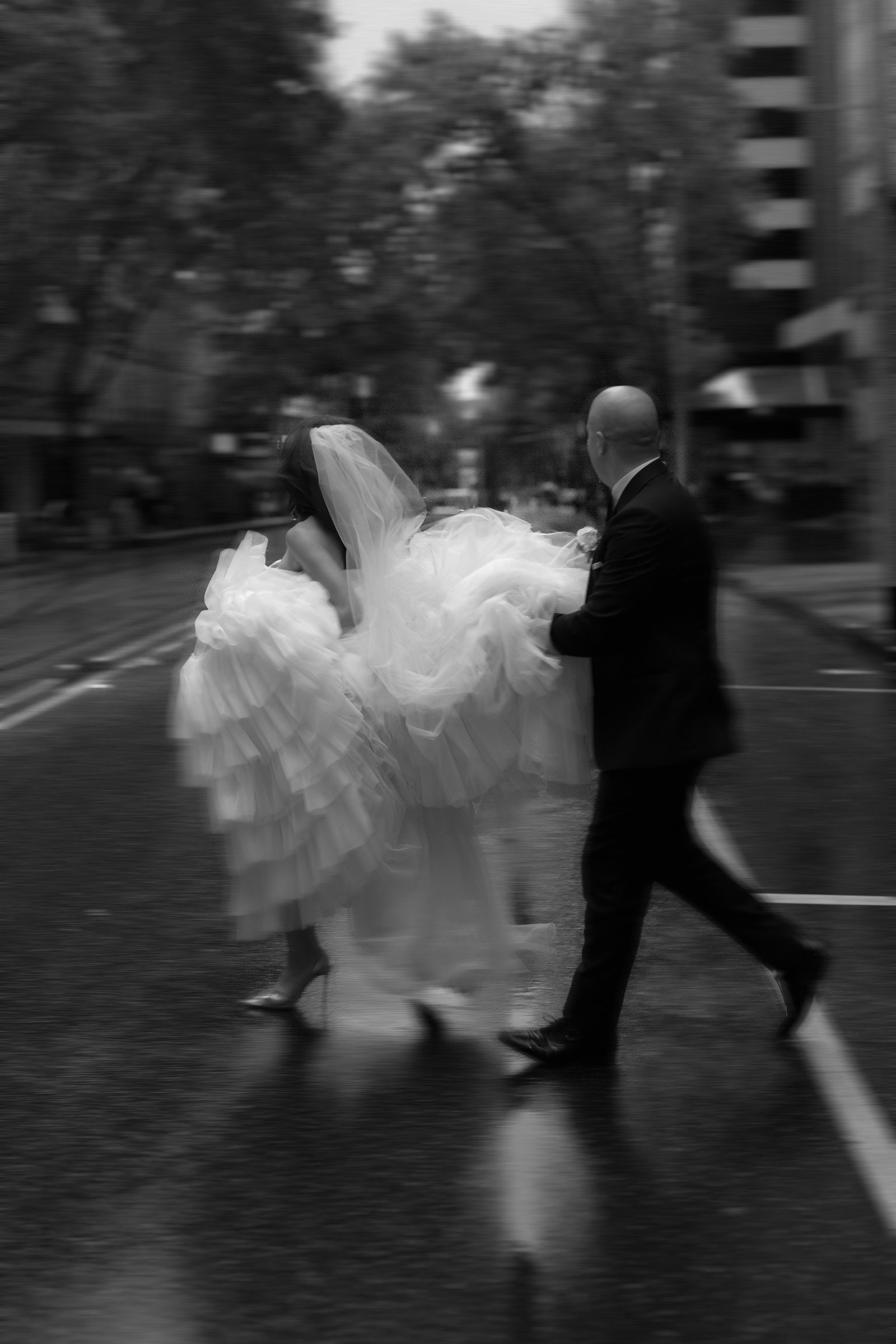 Bride and groom crossing the street in Melbourne