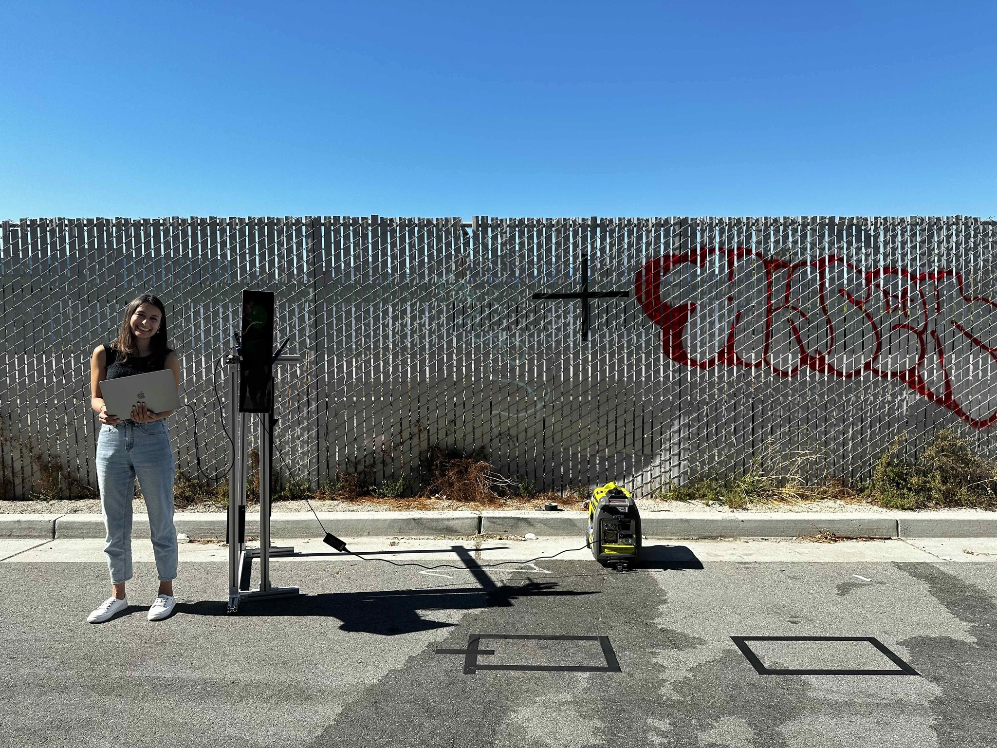 Aditi next to the station screen prototype