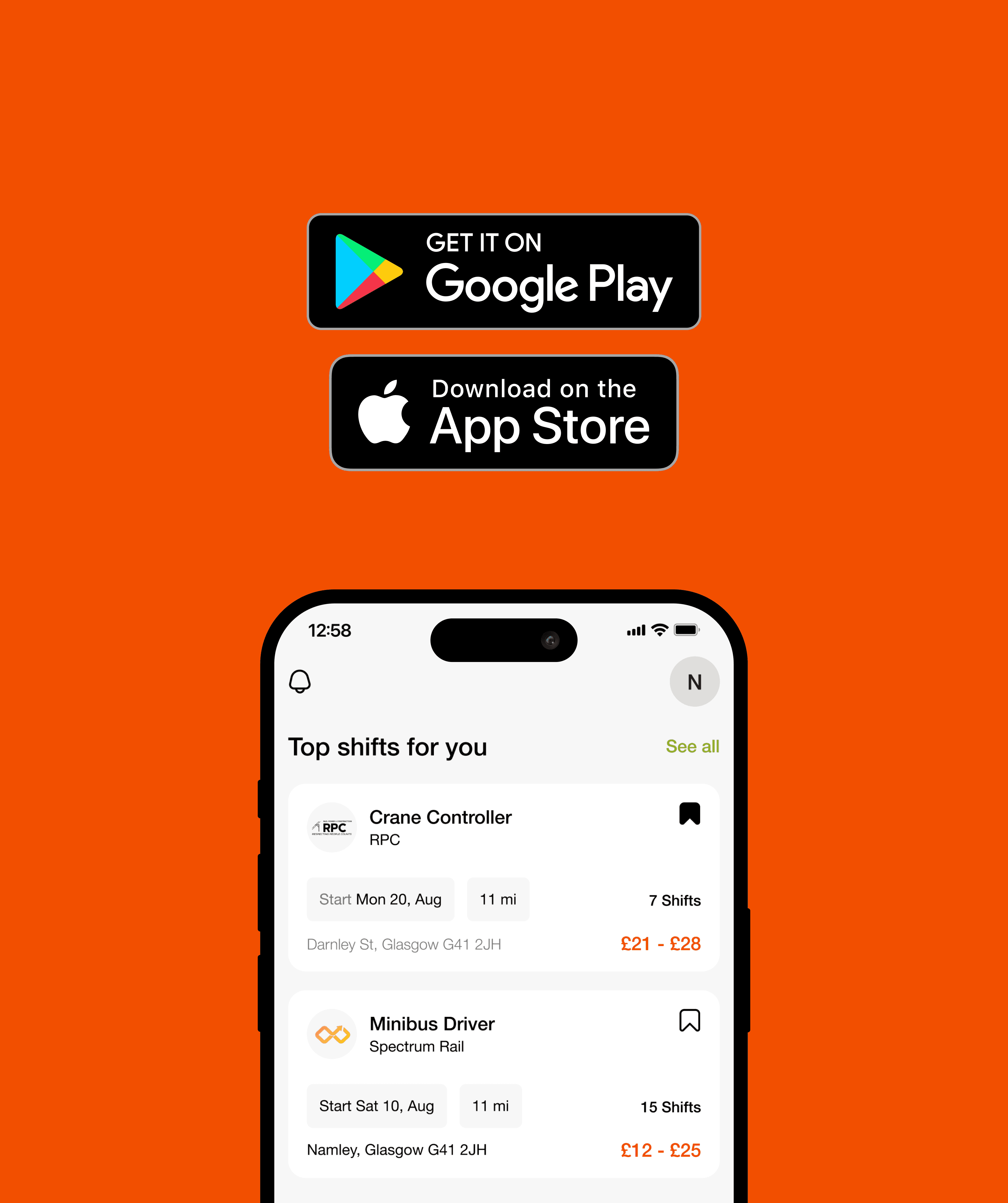 two ladies looking at a laptop and smiling