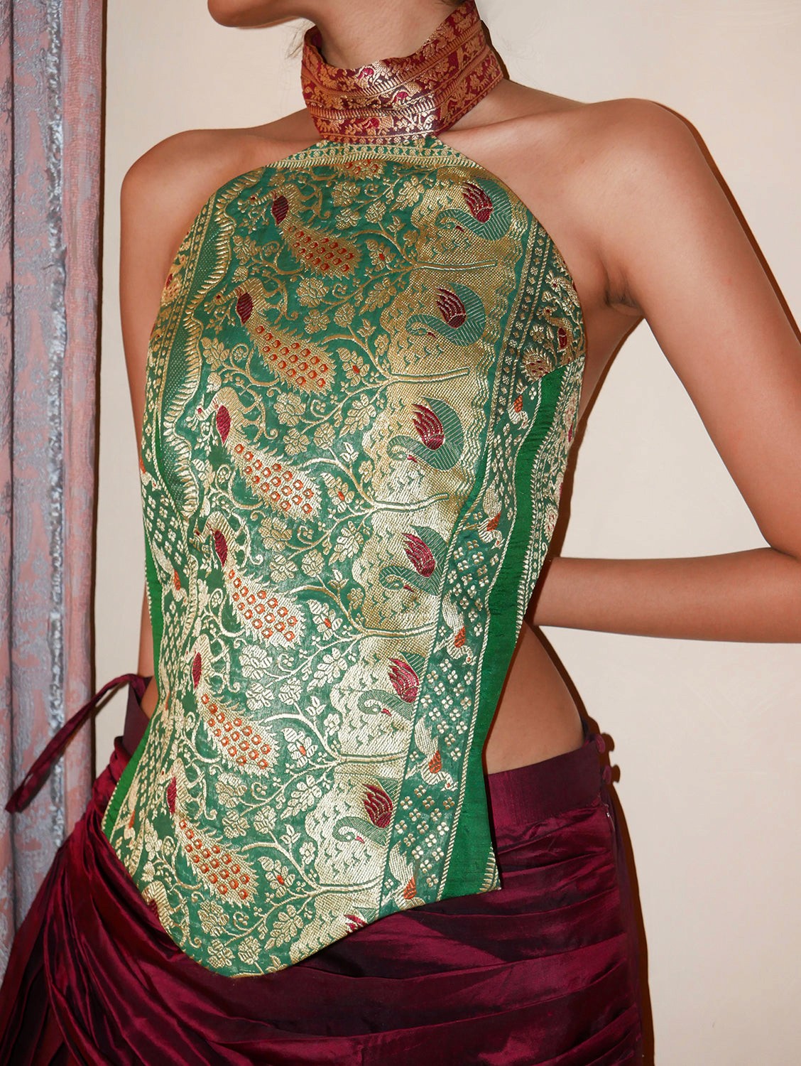 Apsara is our high-neck, backless top crafted from a vintage silk saree, inhouse by skilled artisans.