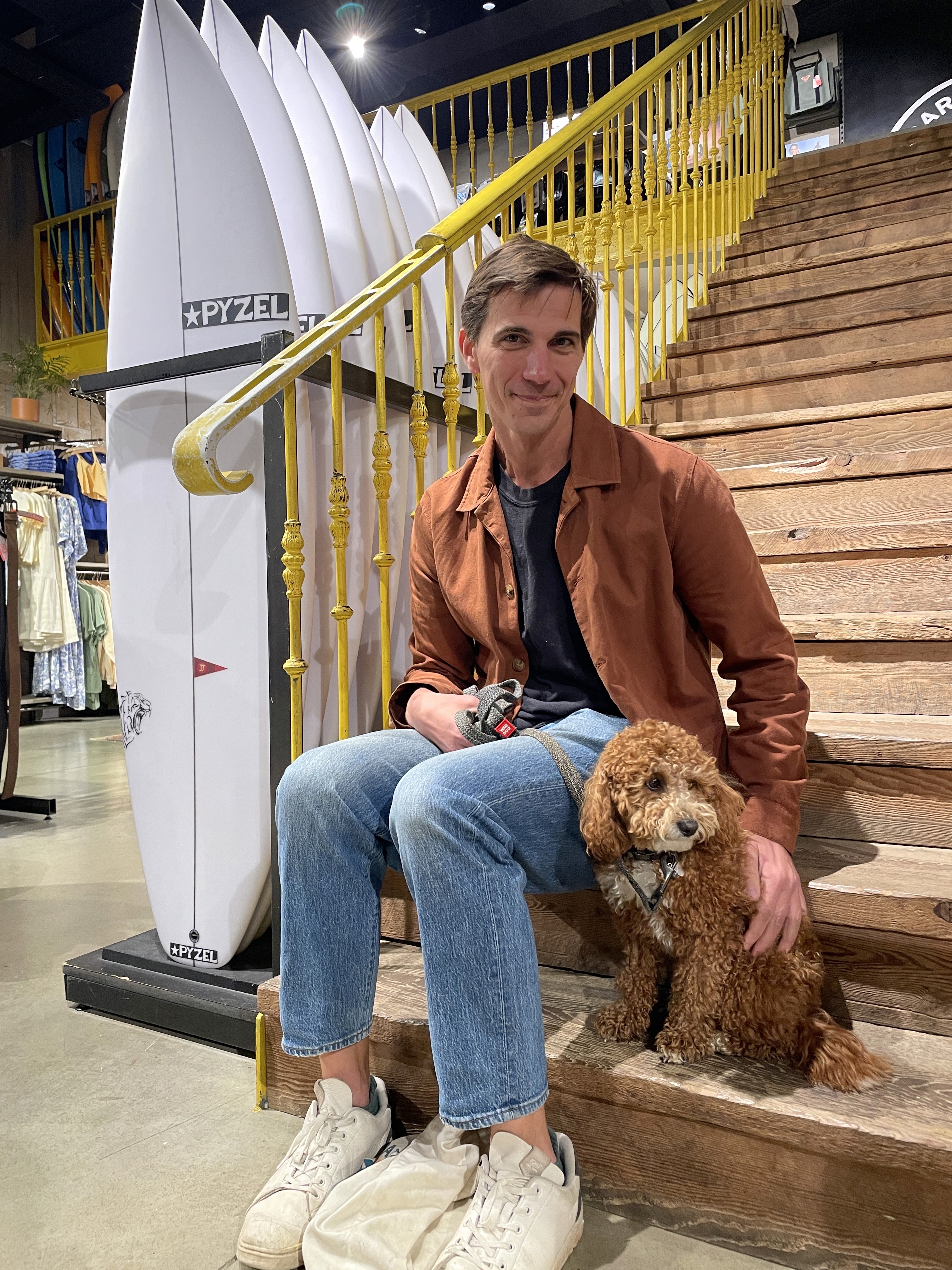 Photo of owner of Wild Souls Coliving and medium brown dog