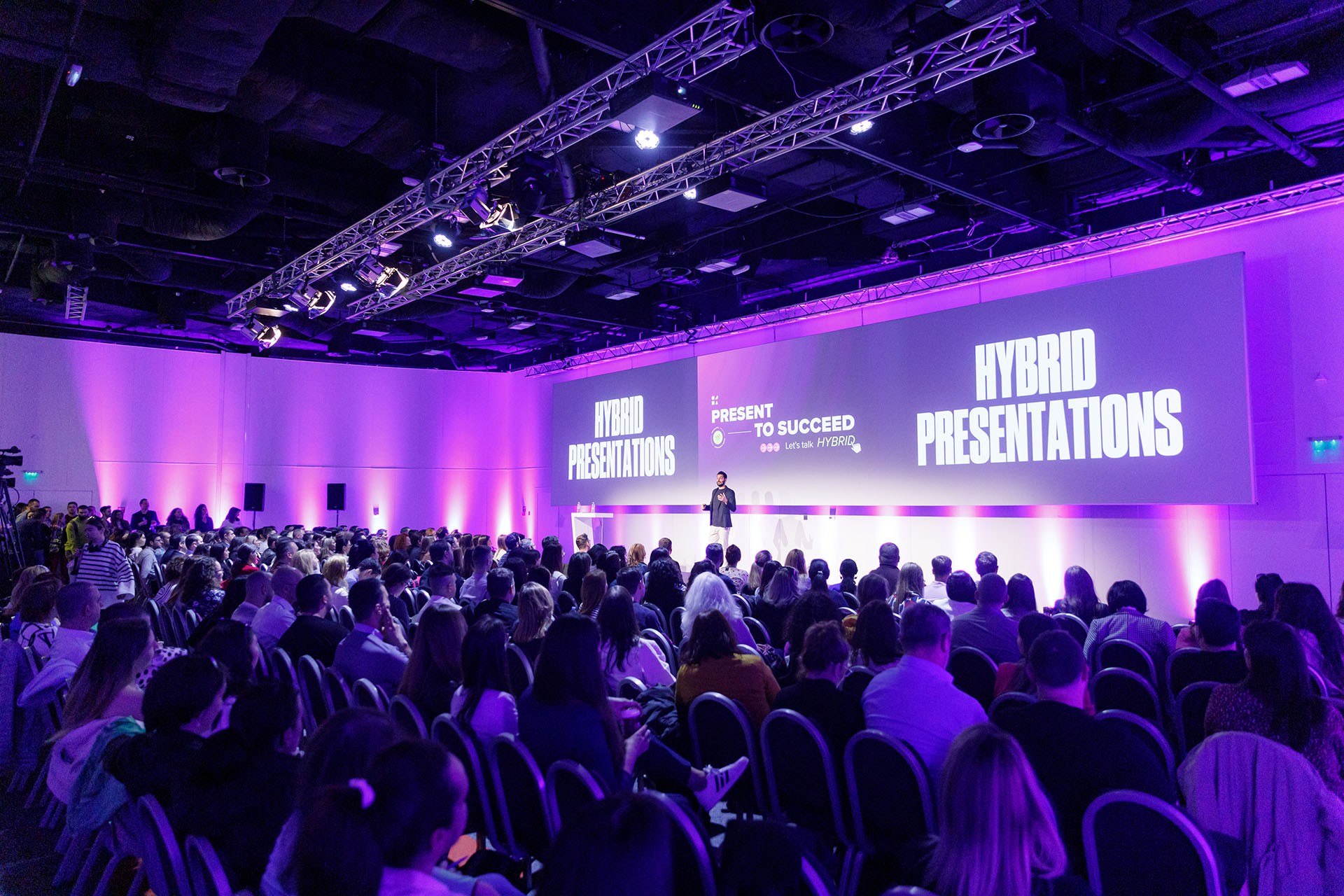 damon nofar giving keynote talk on big stage