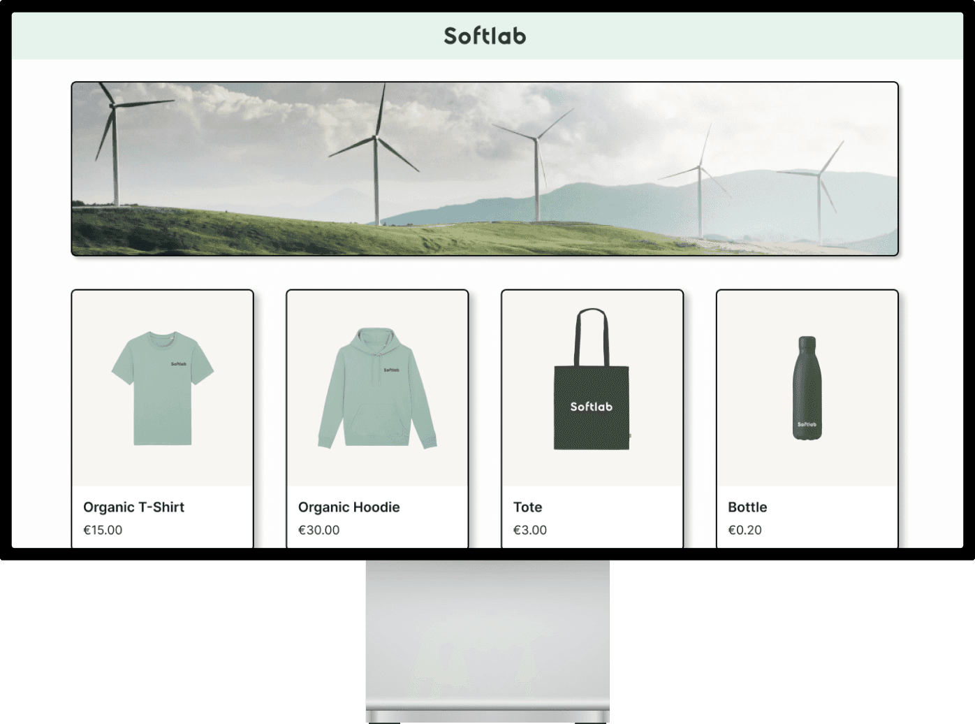 A website interface displaying a scenic background with options for a t-shirt, hoodie, bag, and water bottle.