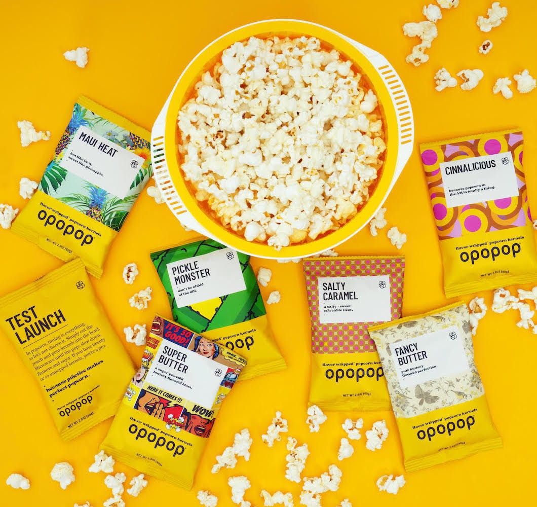 Opopop popcorn bowl with a colorful assortment of flavor packets