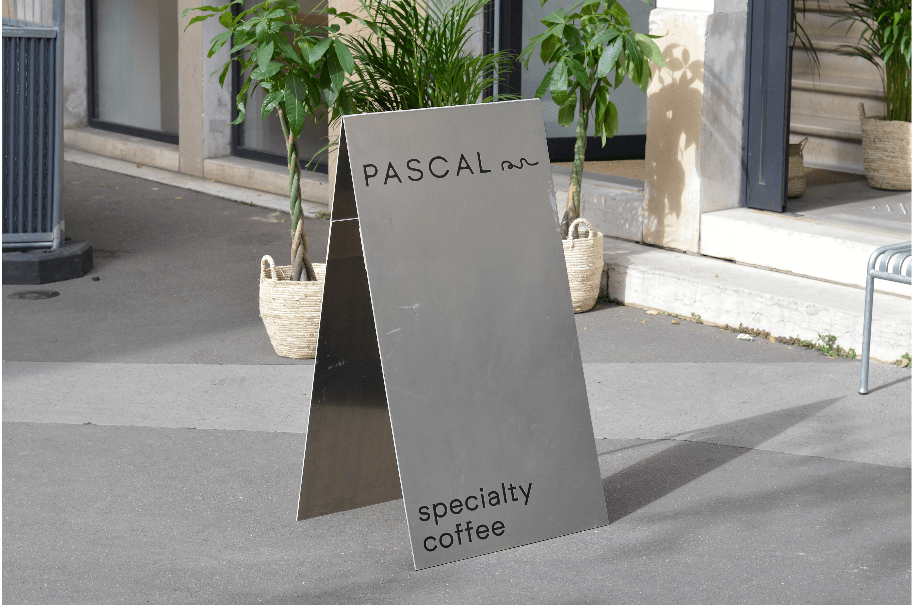 Chair with champagne and glasses by window.