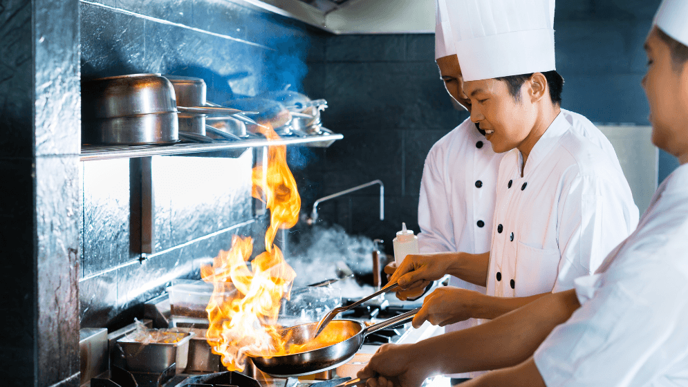 Malaysian chefs cooking in a restaurant