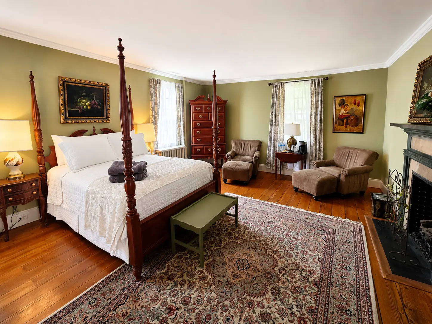 Traditional bedroom with a wooden four-poster bed.
