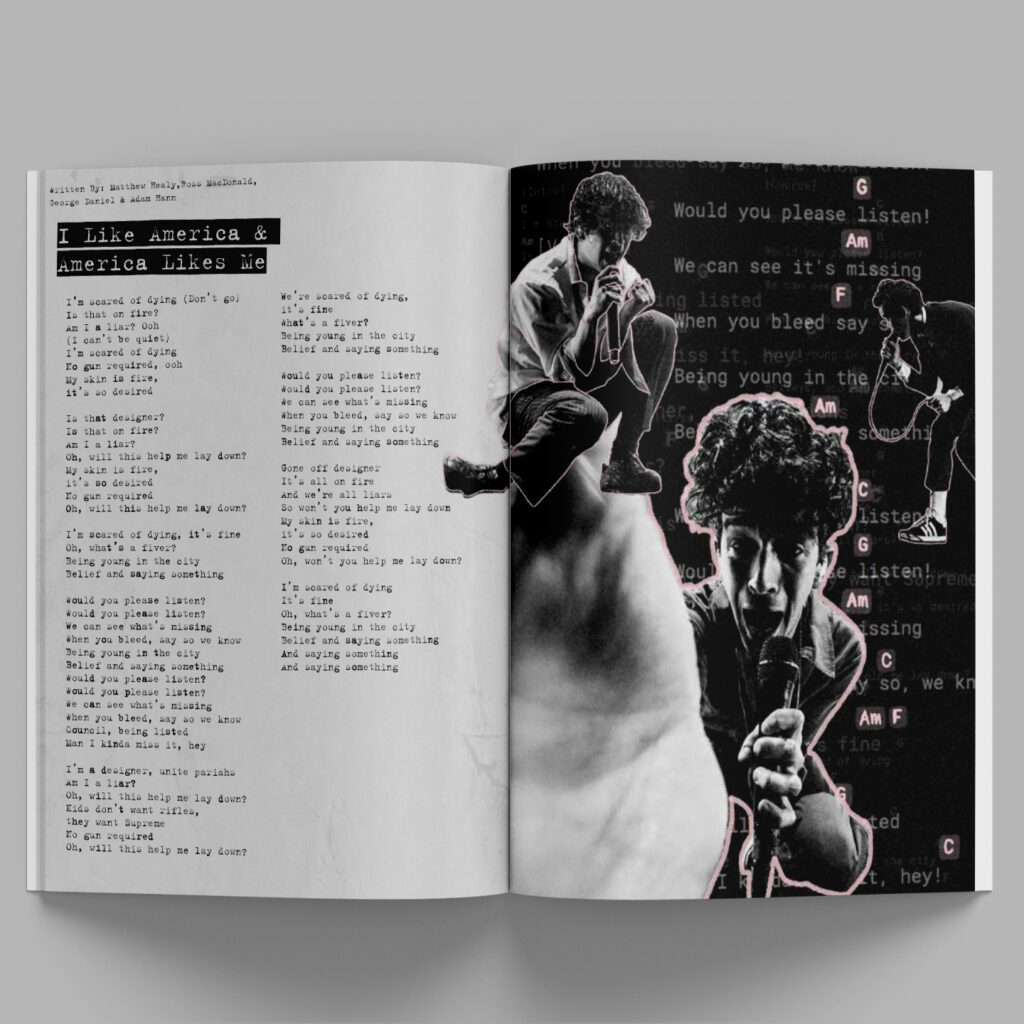 magazine with black and pink design laying on grey background
