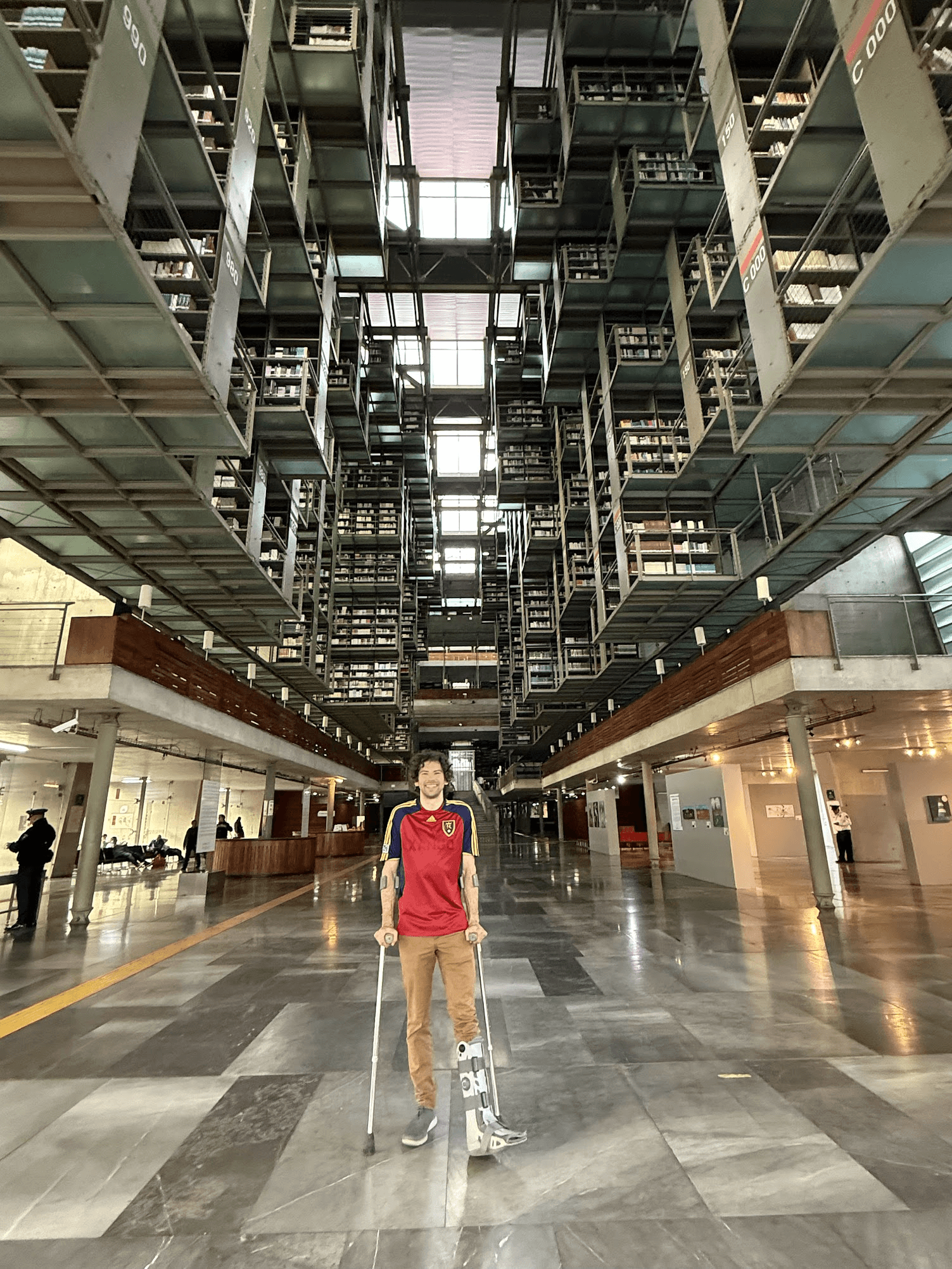 A man stands in the library called Biblioteca Vasconcelos in Mexico City.