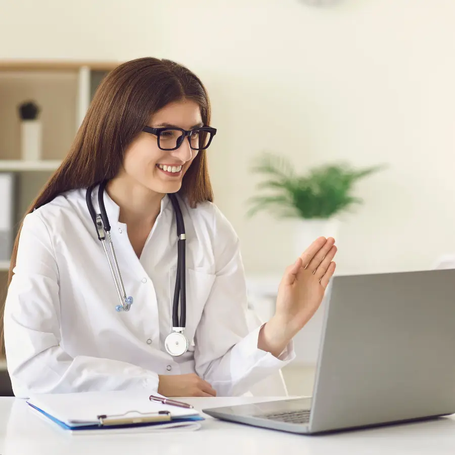 AI medical scribe assisting a doctor during a virtual consultation on a laptop in a modern office.