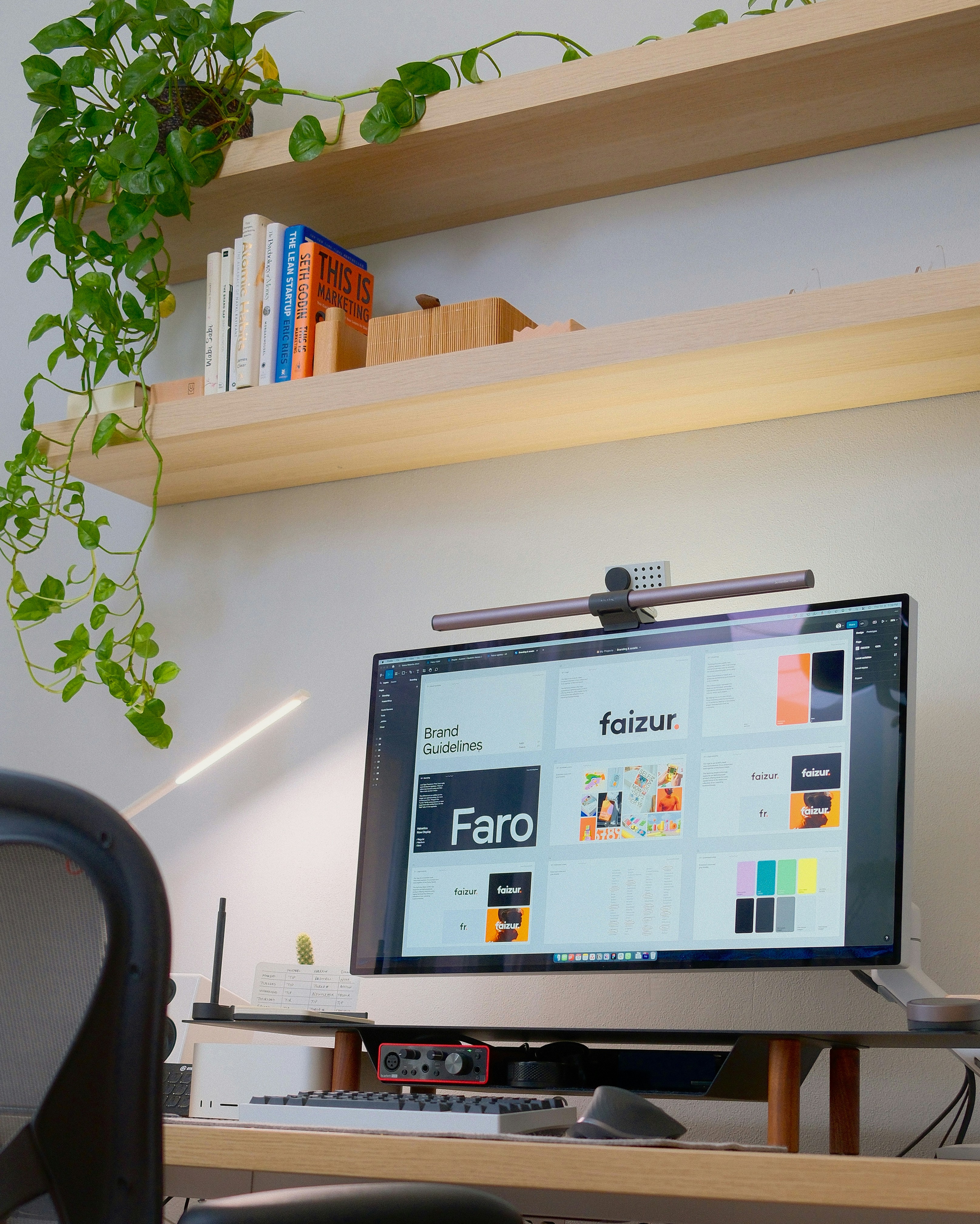 A computer monitor sitting on top of a wooden desk