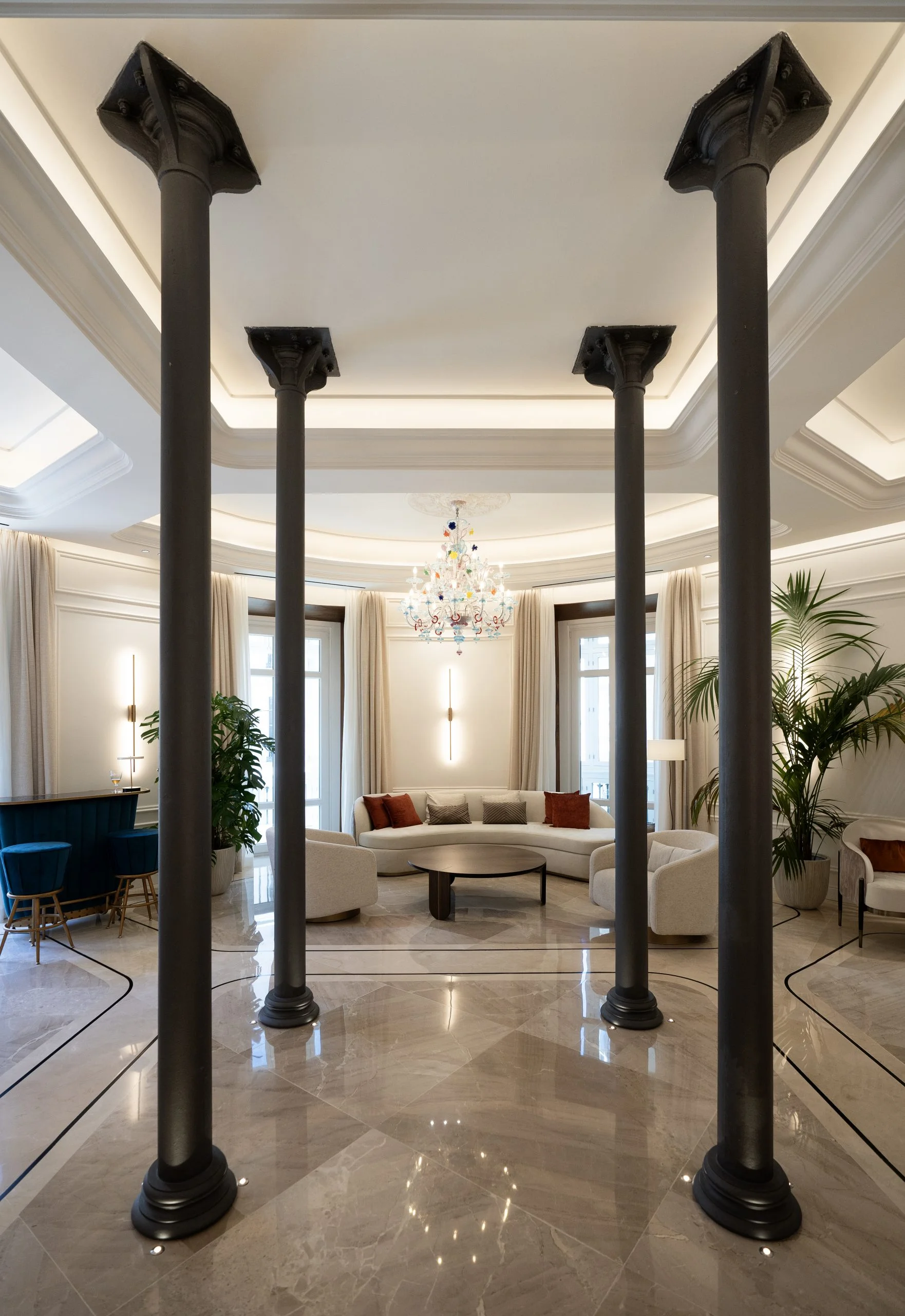 Golden cross atop a domed building with blue sky.
