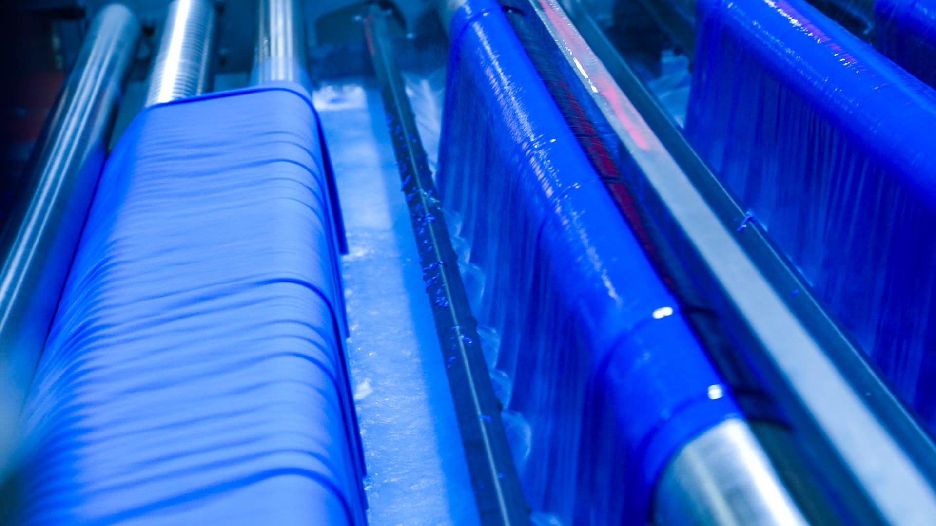 Blue fabric on rollers