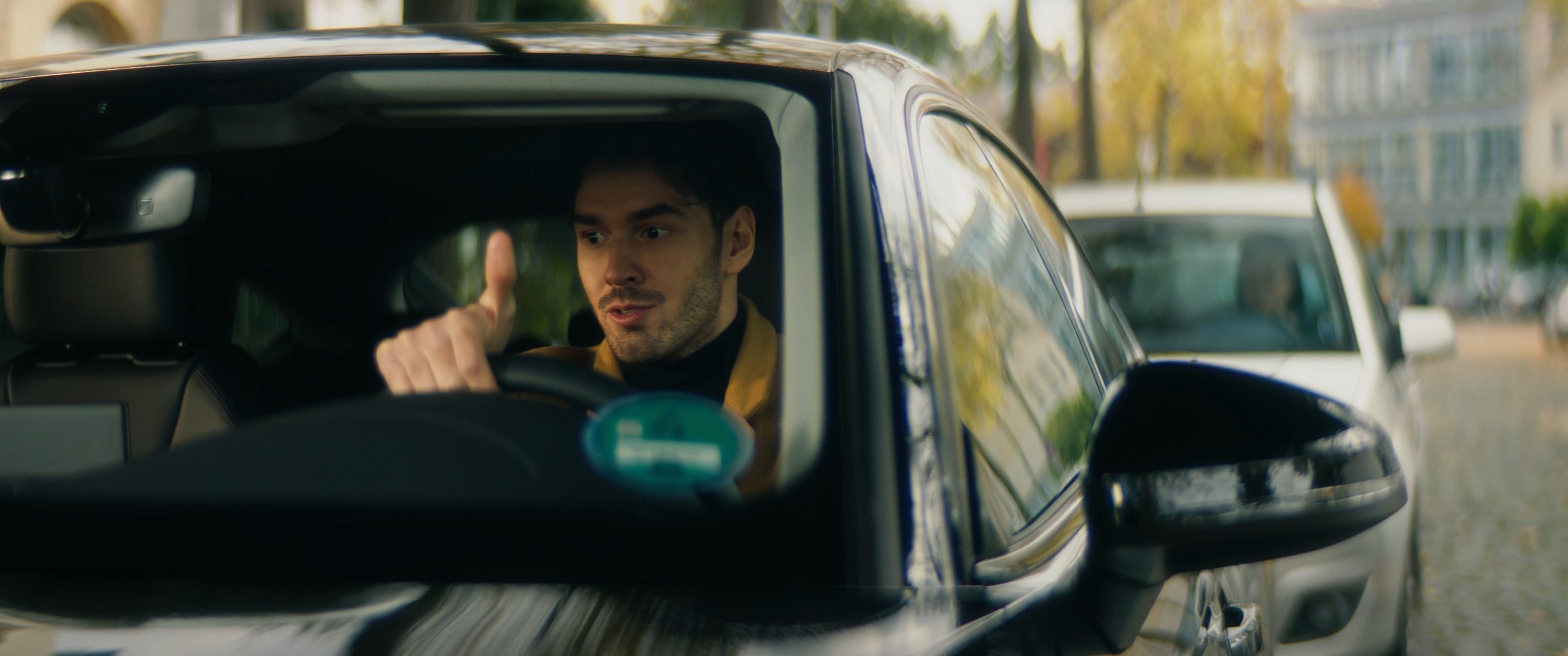 a man sits in a car