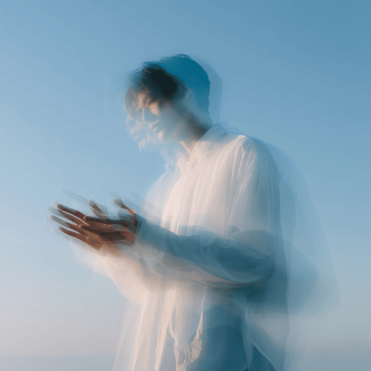 Abstract motion portrait in soft blue tones symbolizing immersive digital experiences and creative delivery.