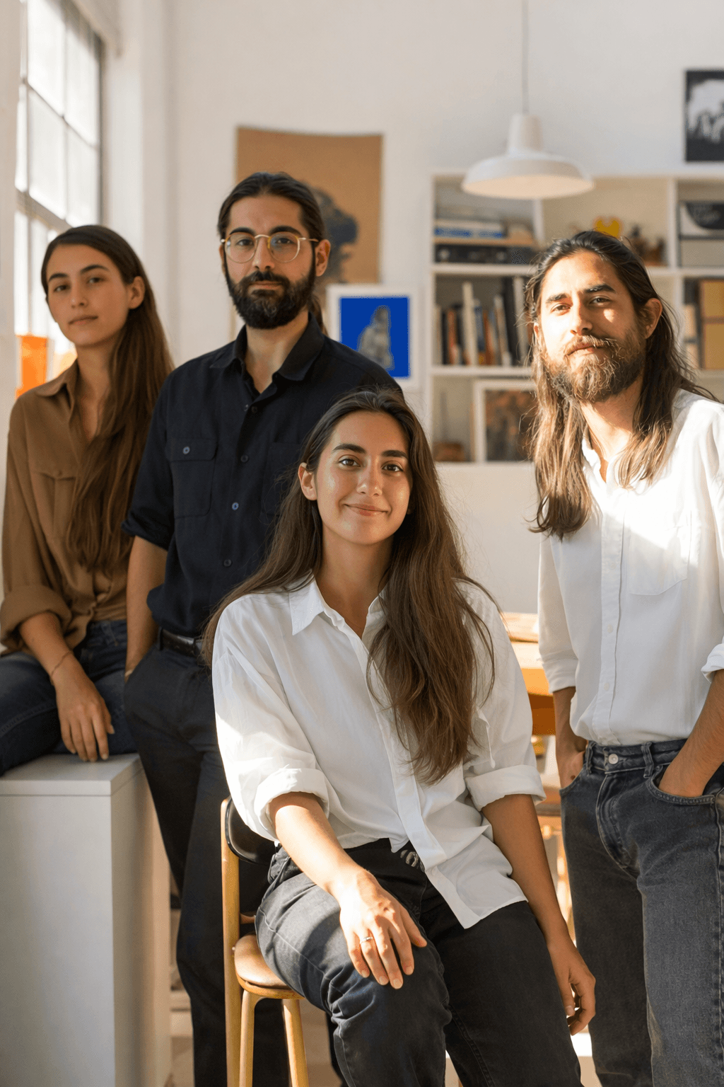 The team of diverse professionals behind the New York-based startup, smiling and collaborating in a modern office setting.