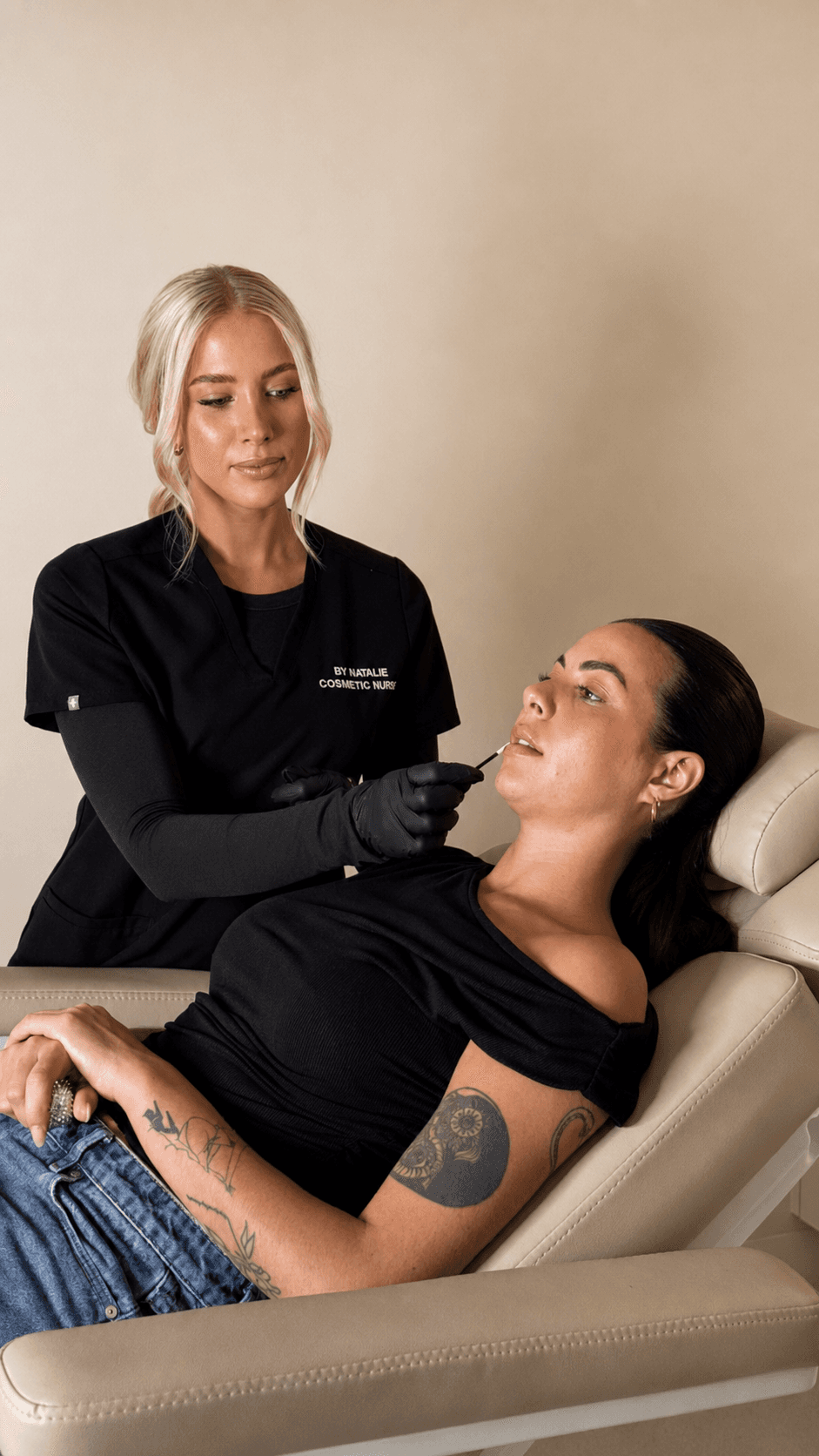Natalie treating a client reclined in the treatment chair