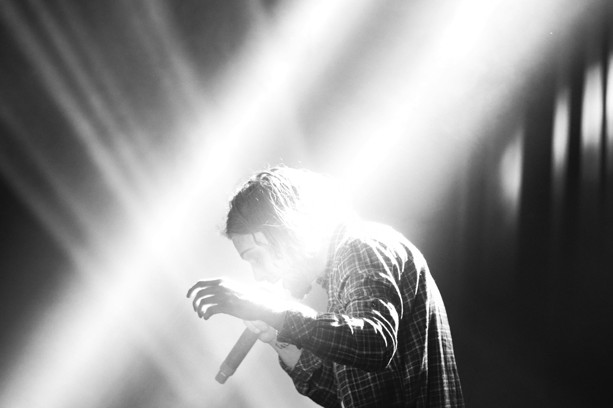 black and white Artist on scene, on hand in the air