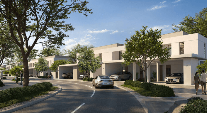 Modern building with signage and parking entrance.