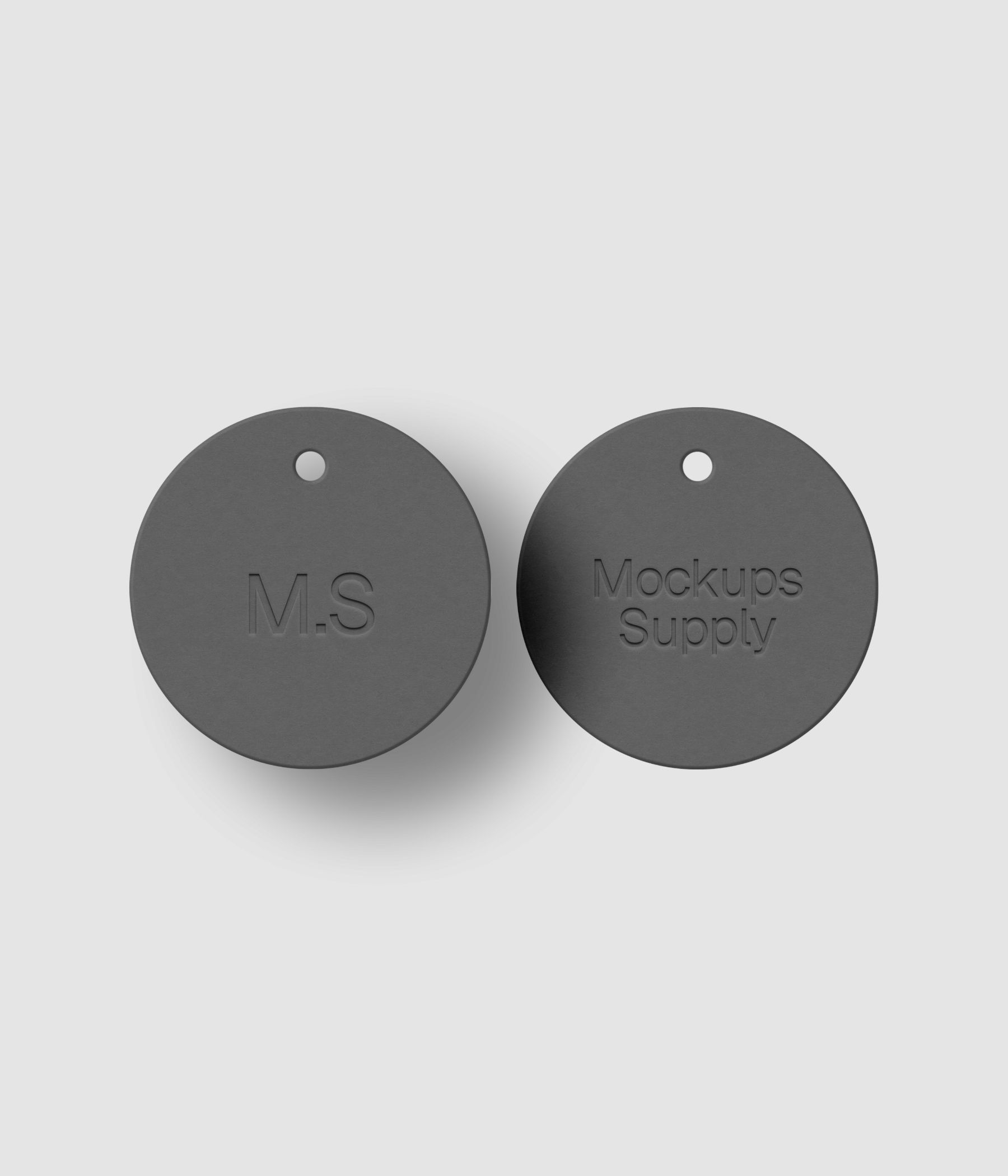 Round white paper tag mockup showing letterpress pressed logo effect with drop shadow for clothing brand presentation