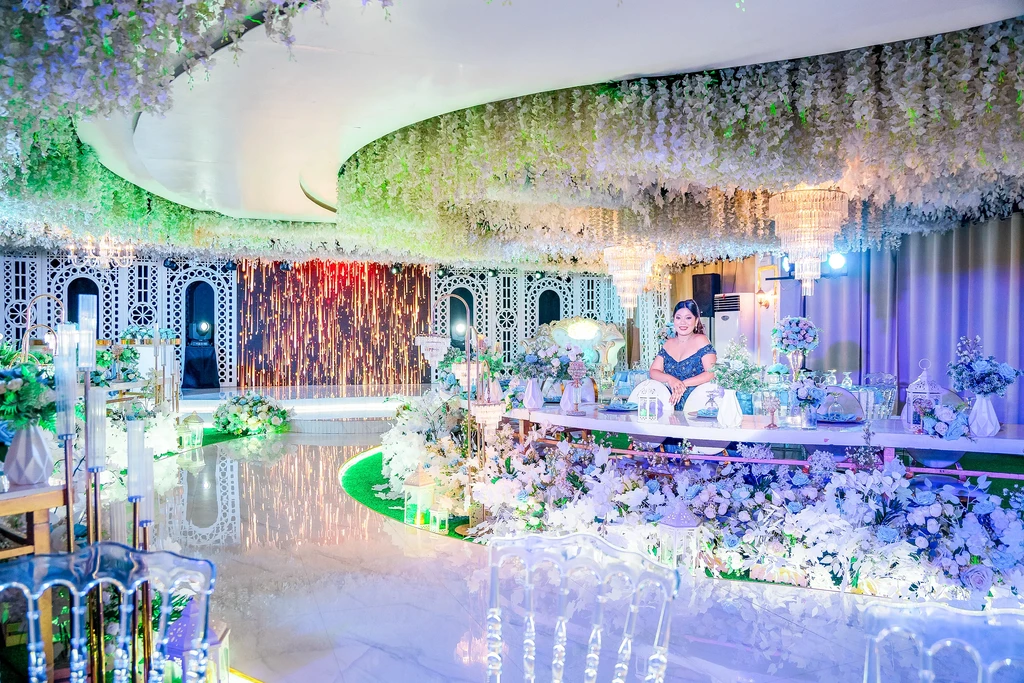 Panoramic view of a debut styled in white florals at Celestia Hall