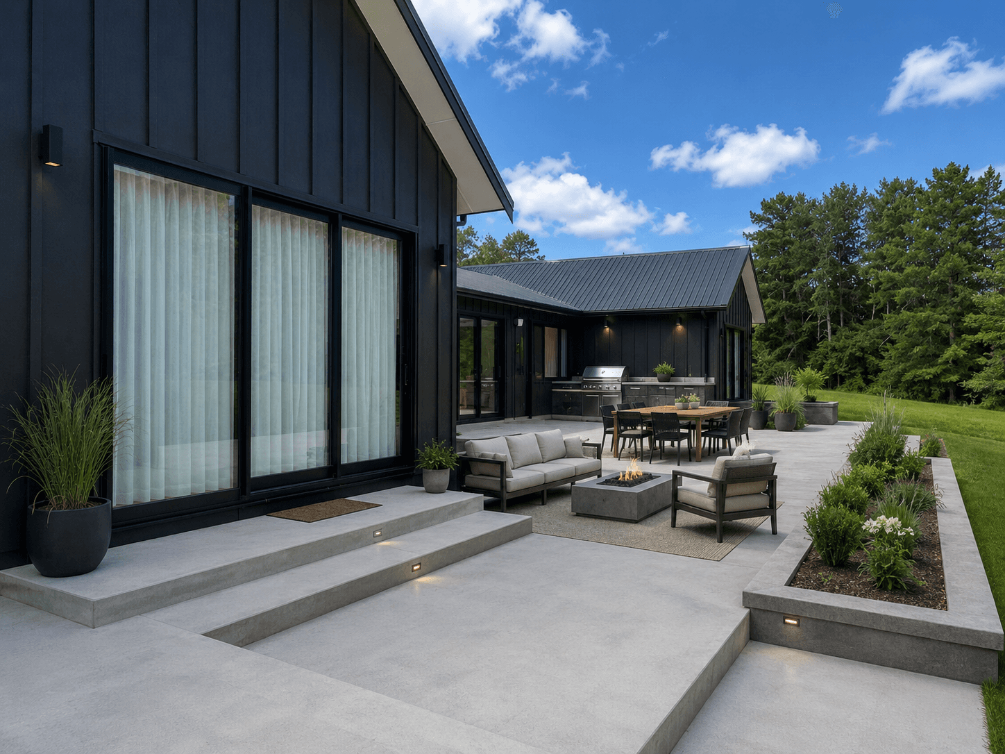 Concrete patio outdoor living area with fire pit and lounge, Auckland