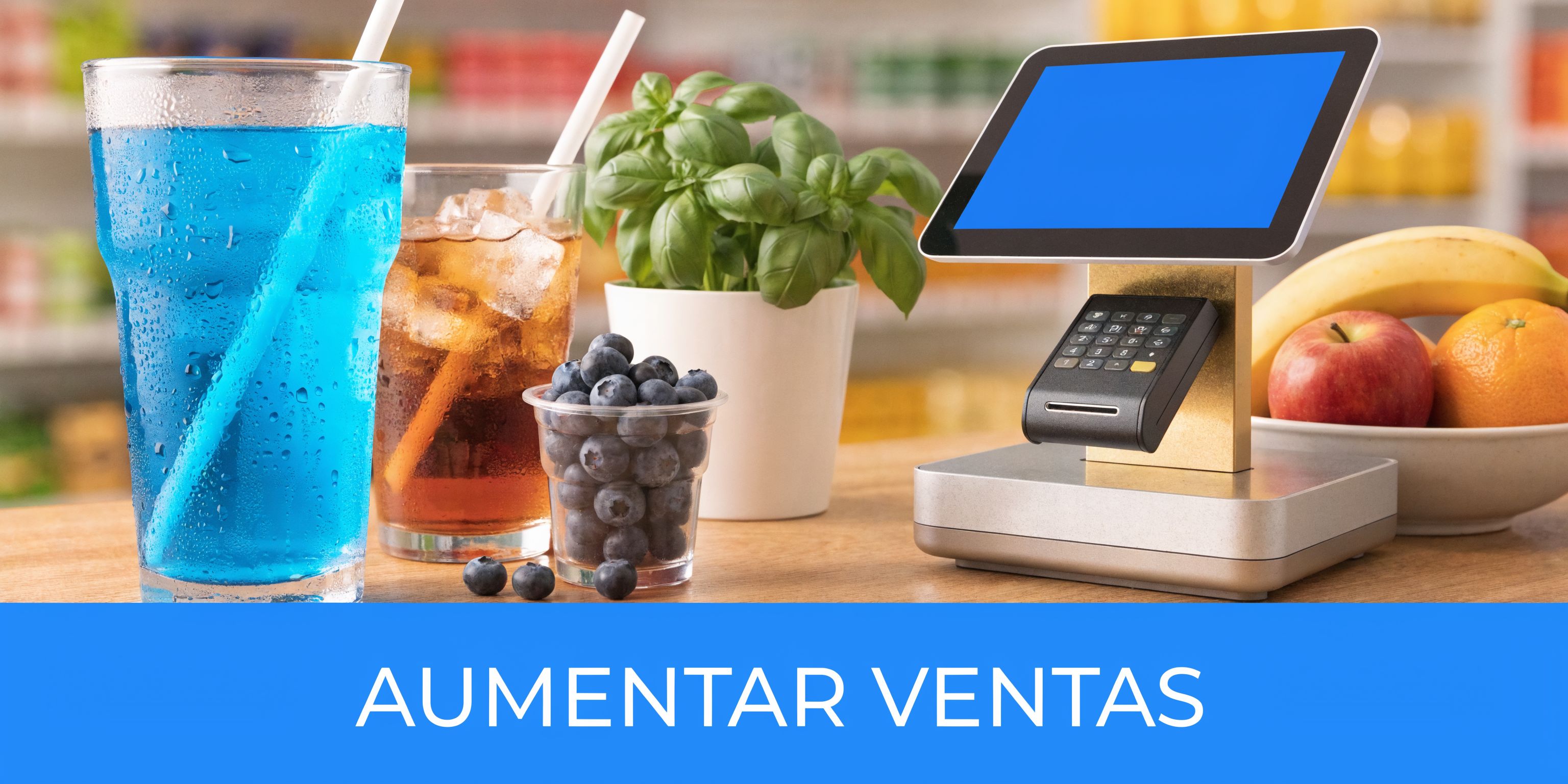 Mostrador de tienda con bebidas frías, fruta fresca, una planta verde y una terminal de punto venta.