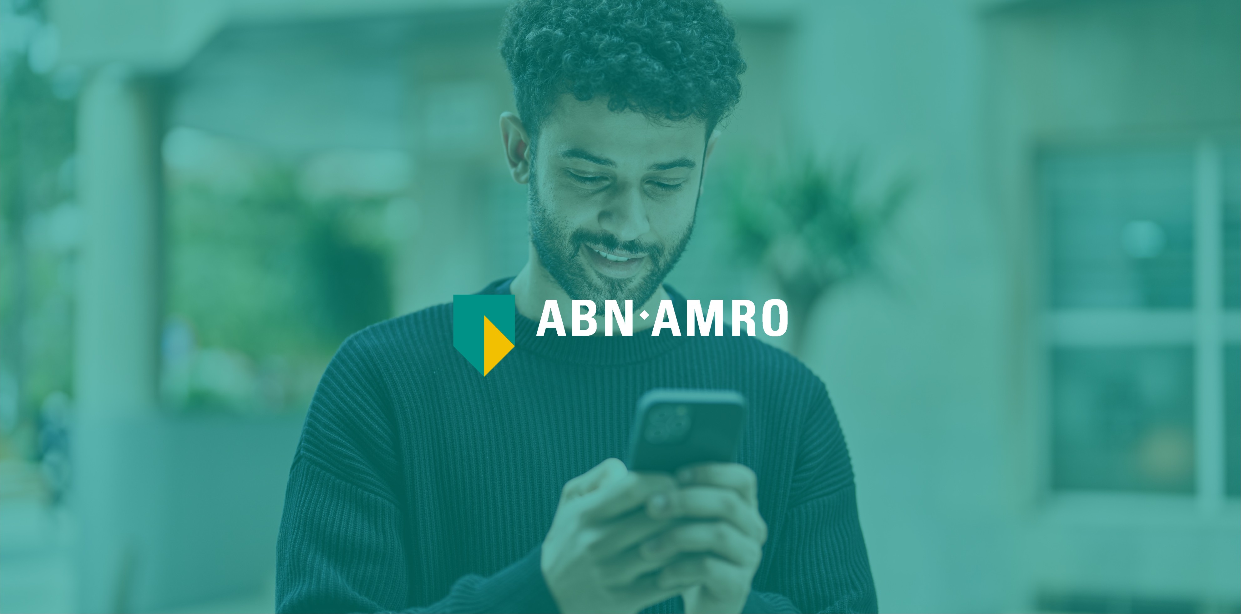 A man is using the ABN-AMRO app on his phone