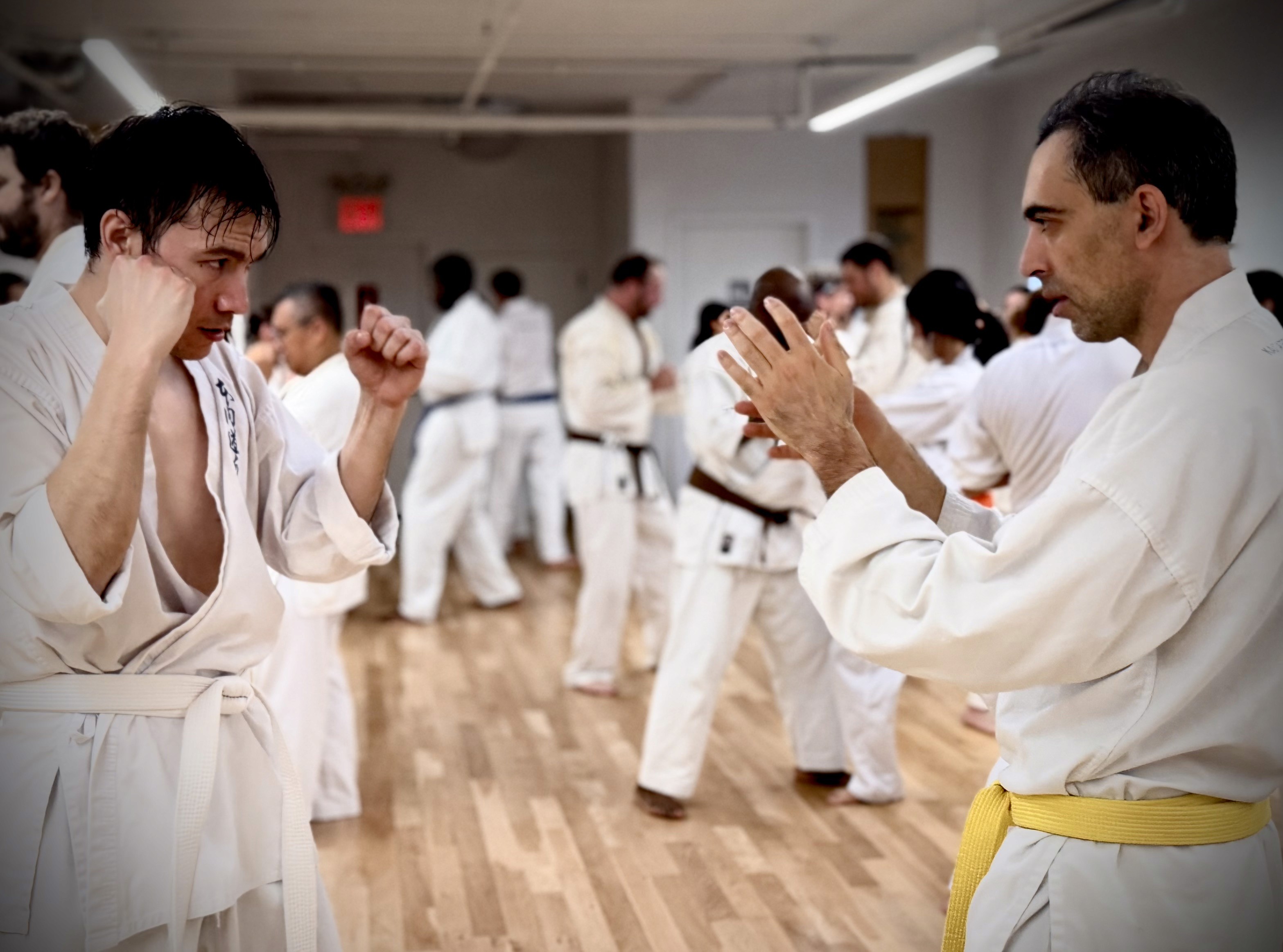 five children smiling while doing peace hand sign