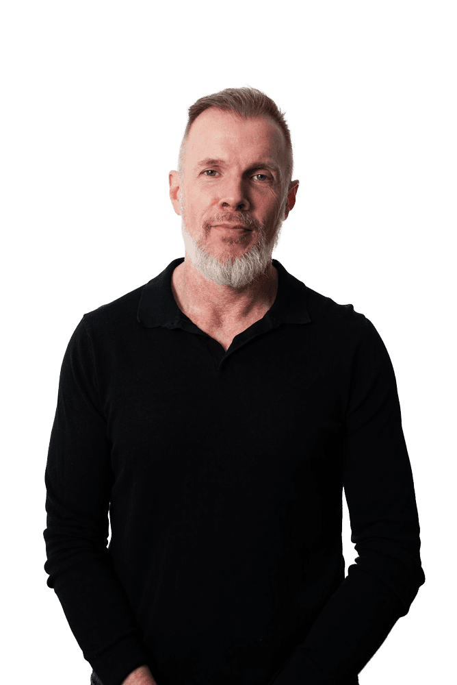 Man with beard and black shirt looking at the camera