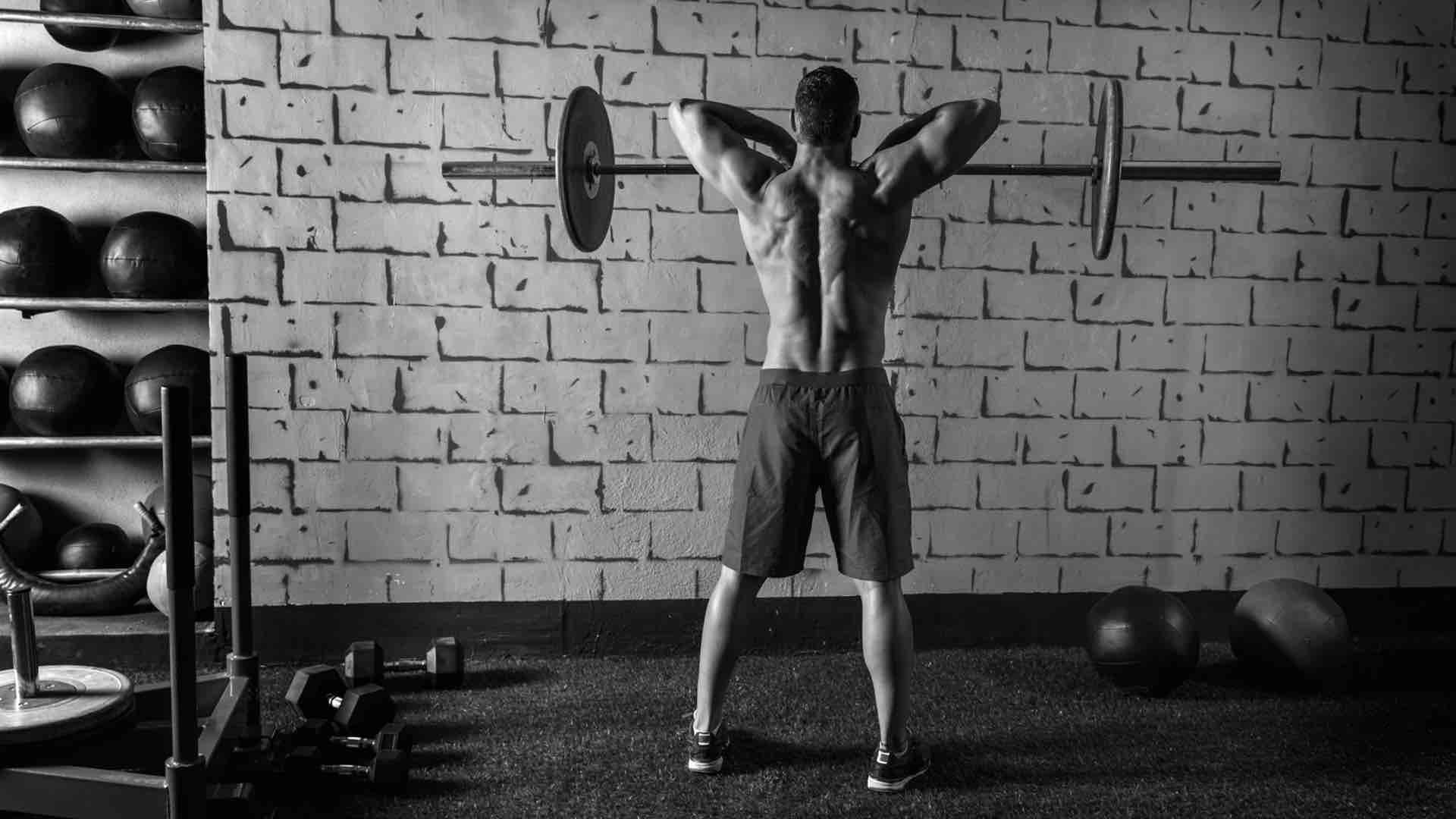 a man lifting a barbell