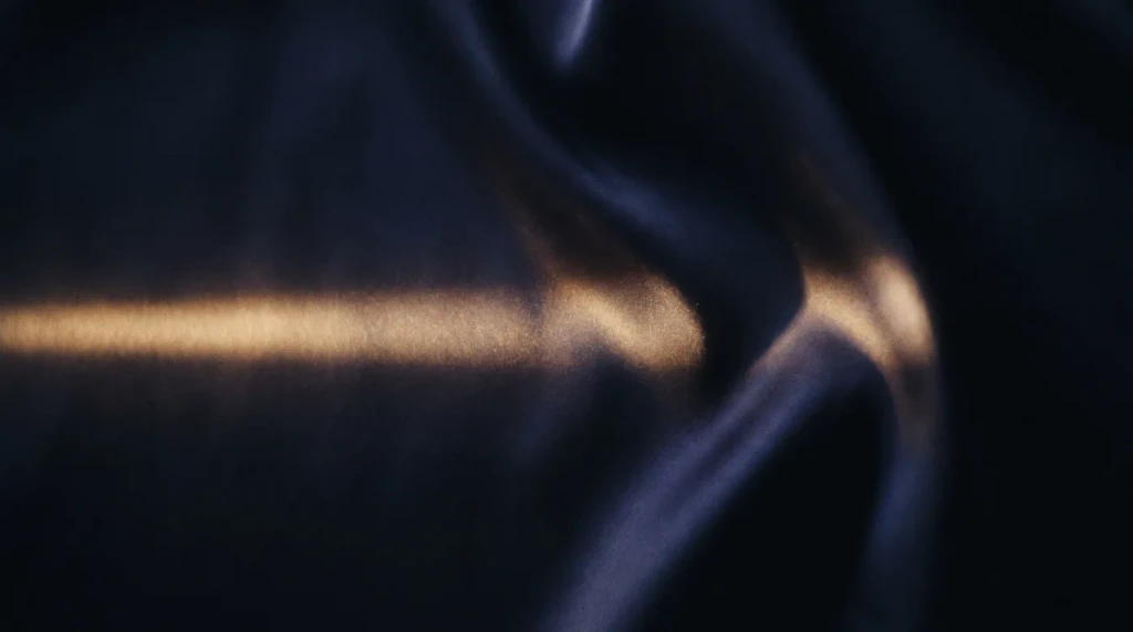 Dark navy satin with one streak of gold light