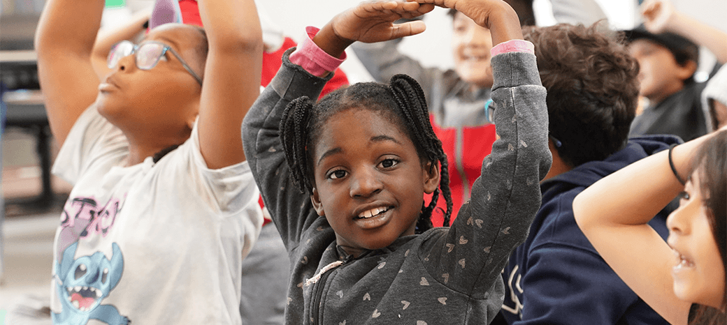 Students participating in interactive improv games during after school theater enrichment program