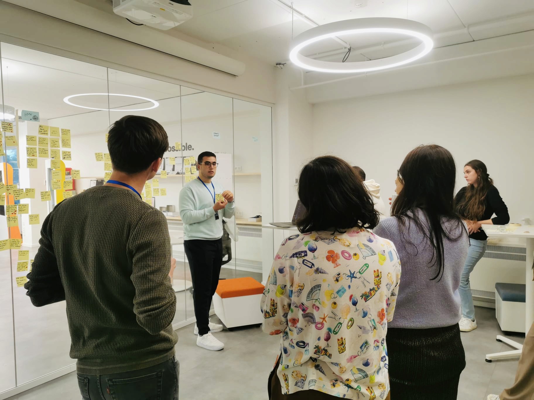 Facilitation session accelerating decision-making with a team gathered in a modern meeting room