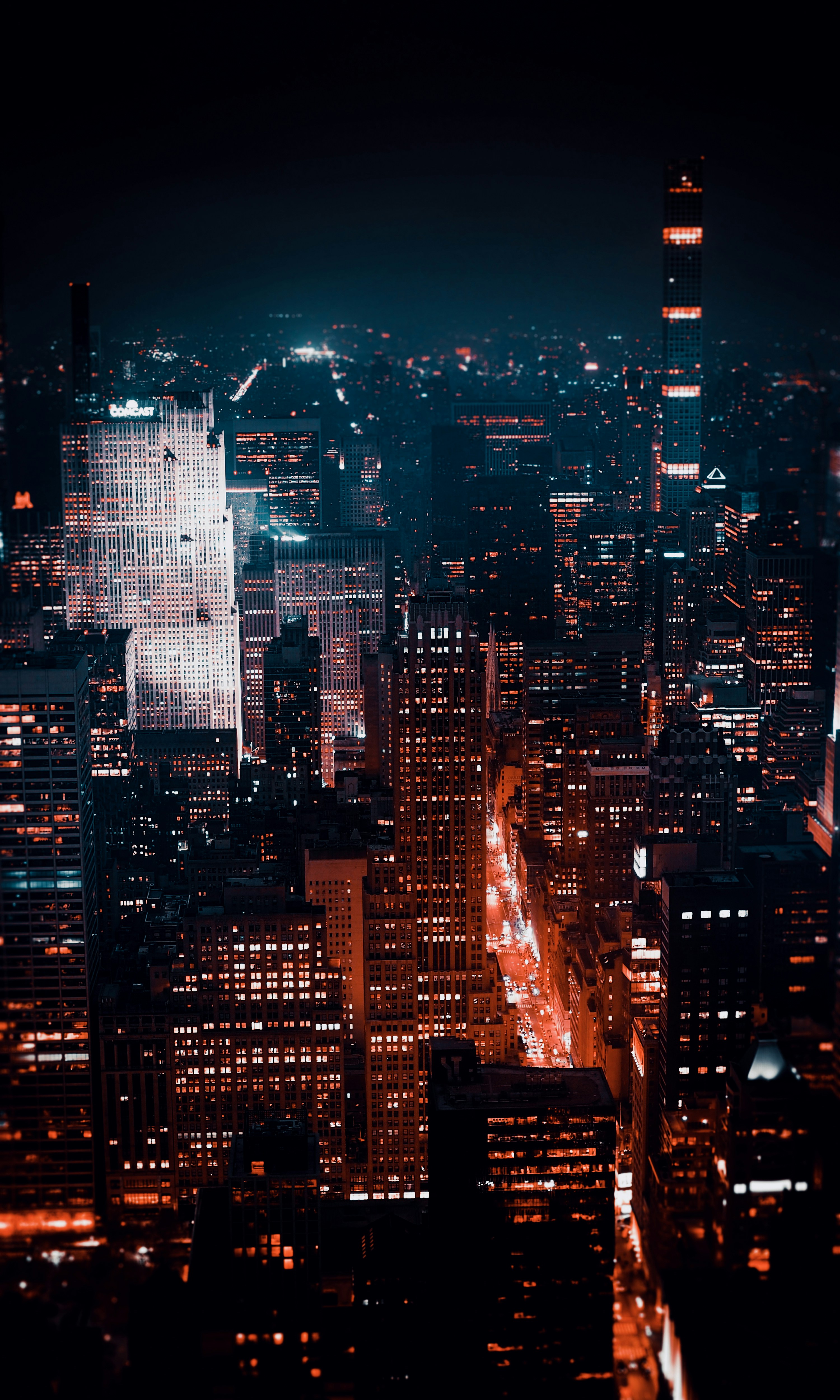 aerial photography of city with high-rise buildings during night time