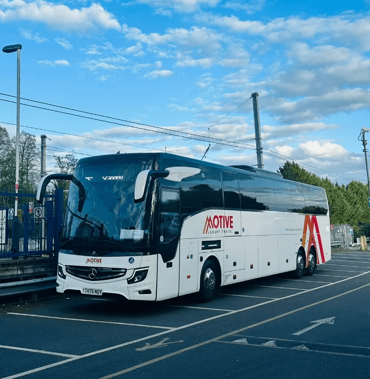 Luxury coach and minibus fleet used for city tours and private transfers, showcasing premium travel services and modern design in urban and scenic environments