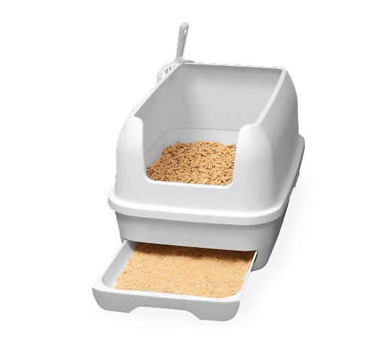 Treasured Pals Sifting Litter Box with high walls, wood pellet litter inside, and a pull-out tray filled with sifted sawdust.