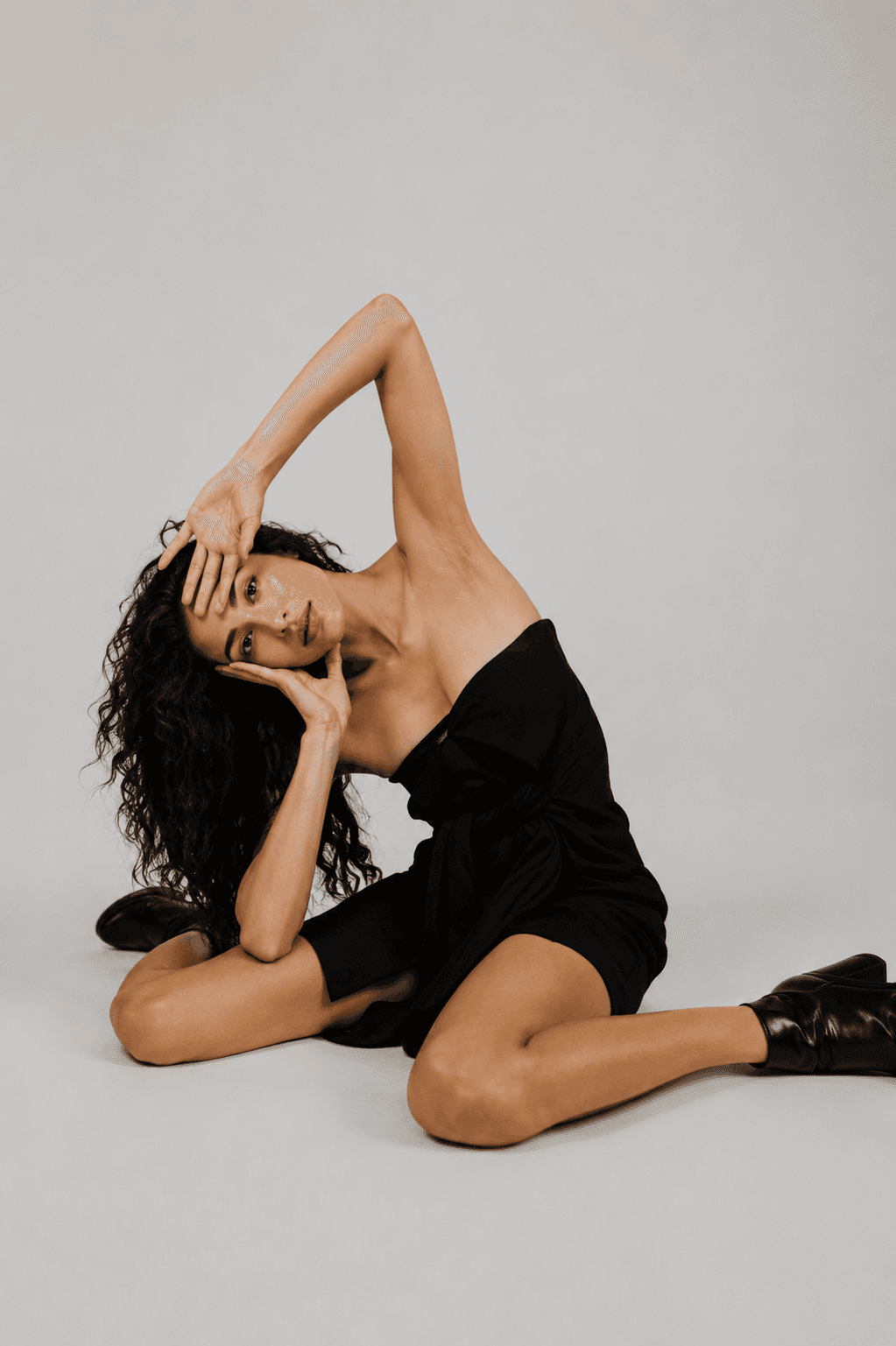Fashion model posing on a studio floor
